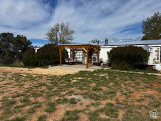 Country living at its best! 5 acres of natural juniper, sage and pinyon pine covered landscape in the heart of Eastland Community. So many possibilities. Build your dream home, keep the existing home for rental income or settle into the existing home where you don't even see your nearest neighbor. Well cared for double wide manufactured home (1978). Roomy open concept kitchen, dining room and living room. Kitchen updated with newer cabinets, beautiful granite countertops and stainless steel undermount sink. Newer stainless-steel appliances. Washer, dryer and extra fridge/freezer included. 4 bedrooms (or office/den) and 2 baths. Heat/Air conditioning replaced 2024. Huge 40x60 shop with partial concrete floor. Numerous other out buildings and silos. Don't let this opportunity pass by to own a country homestead that offers beauty, peace and seclusion.  Square footage figures are provided as a courtesy estimate only and were obtained from Seller estimate.  Buyer is advised to obtain an independent measurement.