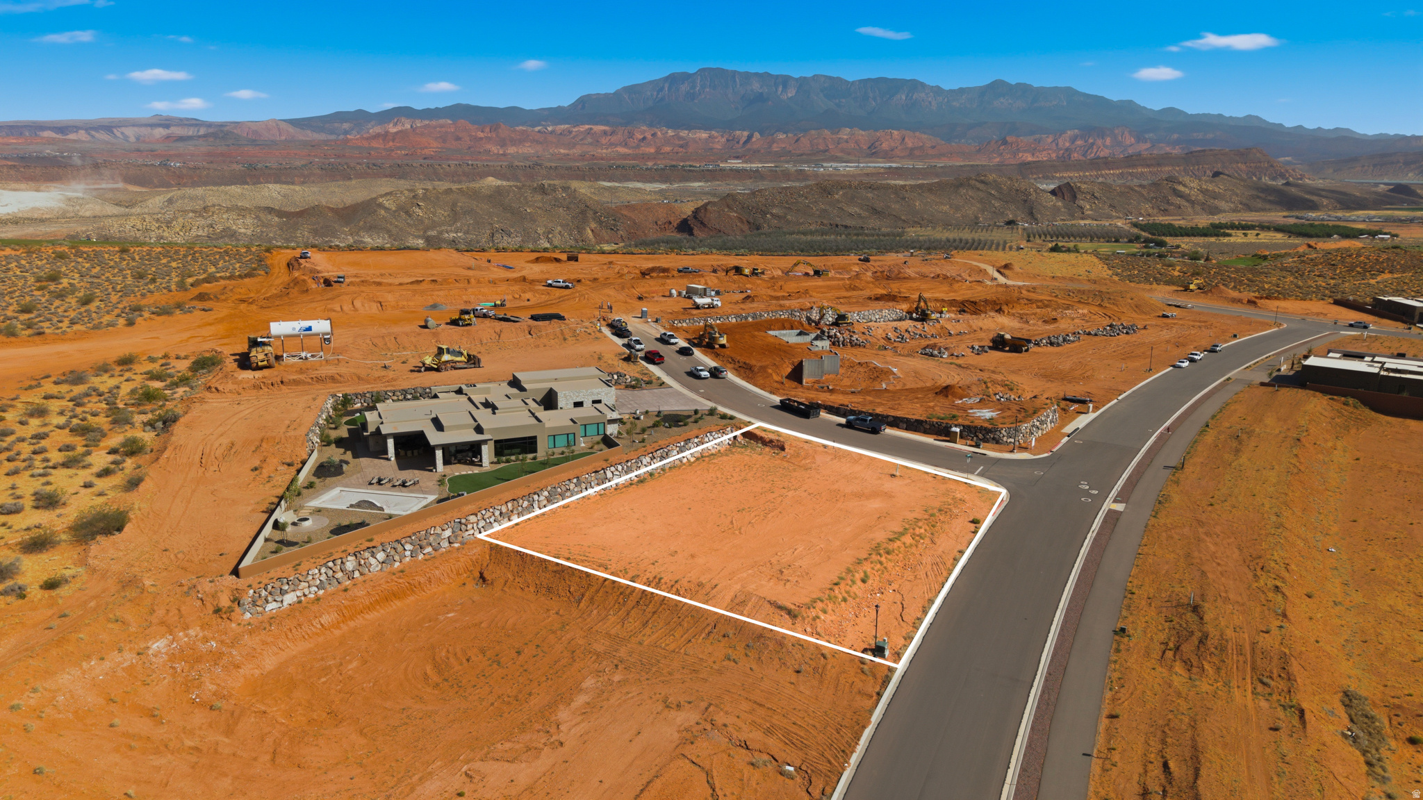 Build your ideal retreat on this expansive .53-acre elevated corner homesite in The Estates at Sand Hollow Resort, a premier golf course community centered around a nationally ranked championship course. Surrounded by multi-million-dollar custom residences, this lot offers exceptional privacy, presence, and views. An ideal setting for a thoughtfully designed luxury home. With ample space for expansive outdoor living, a private pool, and oversized garages, this property perfectly balances refined living with Southern Utah's adventure-driven lifestyle. Enjoy striking desert landscapes, close proximity to championship golf, and effortless access to world-class recreation. Conveniently located just 15 minutes from the airport and 1.5 hours from Las Vegas, this homesite is well suited for a primary residence or a luxury second home. Ownership at Sand Hollow Resort includes valuable homeowner benefits, including front and backyard landscape maintenance for low-maintenance living. Select from a list of Premier Builders, or bring your own developer- approved builder to bring your vision to life.