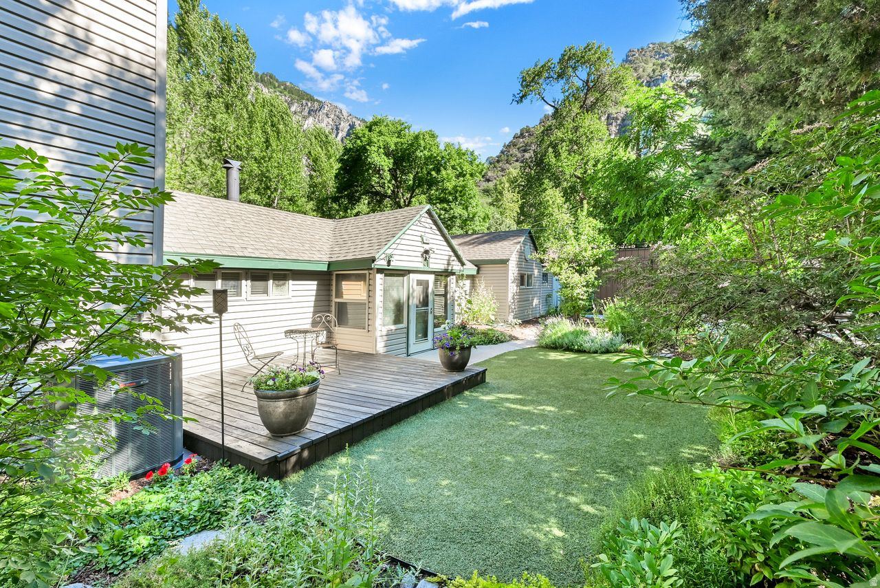 Nestled in the heart of Ogden Canyon this beautiful home overlooks the Ogden River with your own private access to amazing fly fishing and stunning mountain views. Located on a secluded and serene lot in Wildwood Estates the home is surrounded by large trees and majestic mountains. This charming home has 3 bedrooms, 2 bathrooms, a remodeled kitchen and an amazing deck overlooking the river. An addition in 2004 expanded the home to include a spacious family room with a fireplace and a large bar with granite countertop and seating The home boasts a new primary suite with a beautiful rock fireplace and a private deck where you can enjoy the stunning views and the soothing sounds of the river. The kitchen is updated with newer cabinets, granite countertops, tile floor and stainless appliances. The dining area is intimate and inviting with tile floors and windows looking out to the front garden. A charming cozy den features a Lopi woodburining stove and is surrounded by windows overlooking the river. The main level is completed with two bedrooms and an updated full bathroom. Located minutes from world class skiing, boating, hunting, biking and hiking. This is a rare find! a true "one-in-a-million" place to live!!