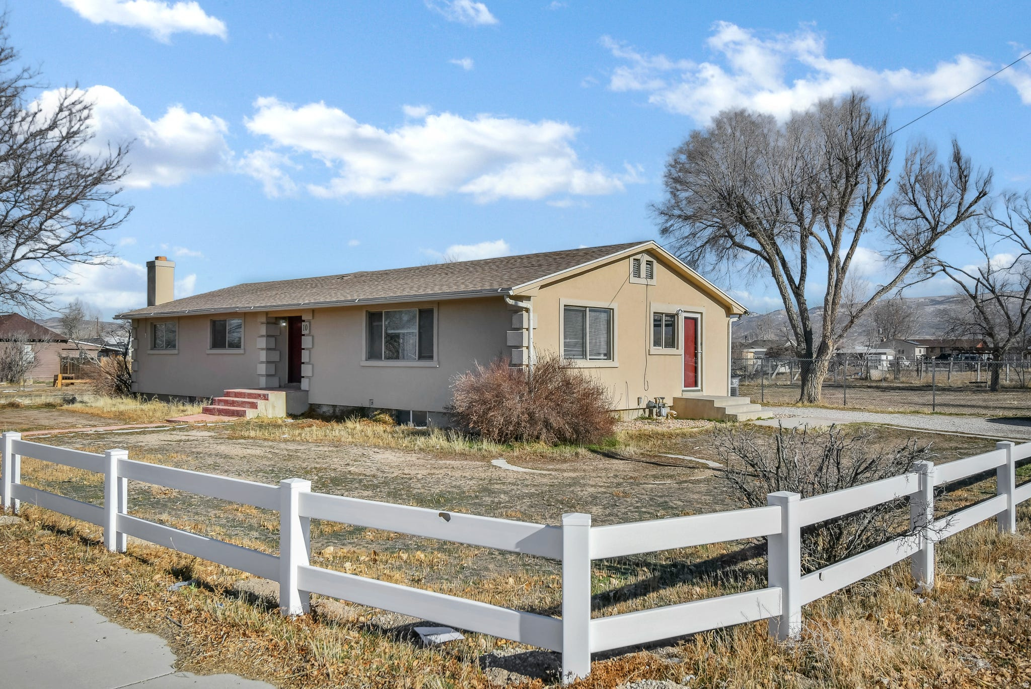 Fresh, clean, and move-in ready, this 1.5-acre horse property in Centerfield offers functional country living with room to grow. The main floor features four bedrooms, three bathrooms, and a convenient laundry room, while the downstairs bring your wood burning stove or gas stove for a cozy fire, a wet bar, and plenty of storage with flexible space for entertaining or everyday living. Outside, the fully fenced acreage is set up for animals and includes multiple outbuildings ideal for hay, tack, equipment, or a workshop, and water shares are rented from the city and attached to the property, making this a rare opportunity for peaceful rural living with usable land and endless potential.  Square footage figures are provided as a courtesy estimate only and were obtained from county .  Buyer is advised to obtain an independent measurement.