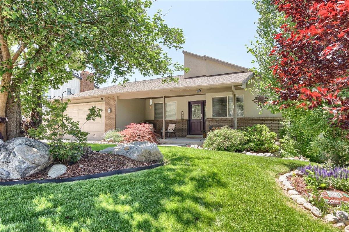 Welcome to this quiet and spacious East Sandy home with its own mother-in-law apartment and private entrance-perfectly located just a 5-minute drive from Little Cottonwood Canyon, and a 10-minute walk from Granite Park & Dimple Dell. This house sits on a quarter-acre lot and features a large primary bedroom with balcony access and a huge ensuite bathroom. The covered balcony stretches across the entire back of the house, providing beautiful sunset views and a perfect indoor/outdoor entertaining space just off the kitchen. Down the balcony stairs, you'll find a large covered patio and a beautifully landscaped backyard fully fenced, peaceful, and private. Other features include tucked-away RV parking, new kitchen appliances, newer furnace & AC (2020), roof installed in 2014. Book a showing today to get a slice of crisp East Bench mountain air.