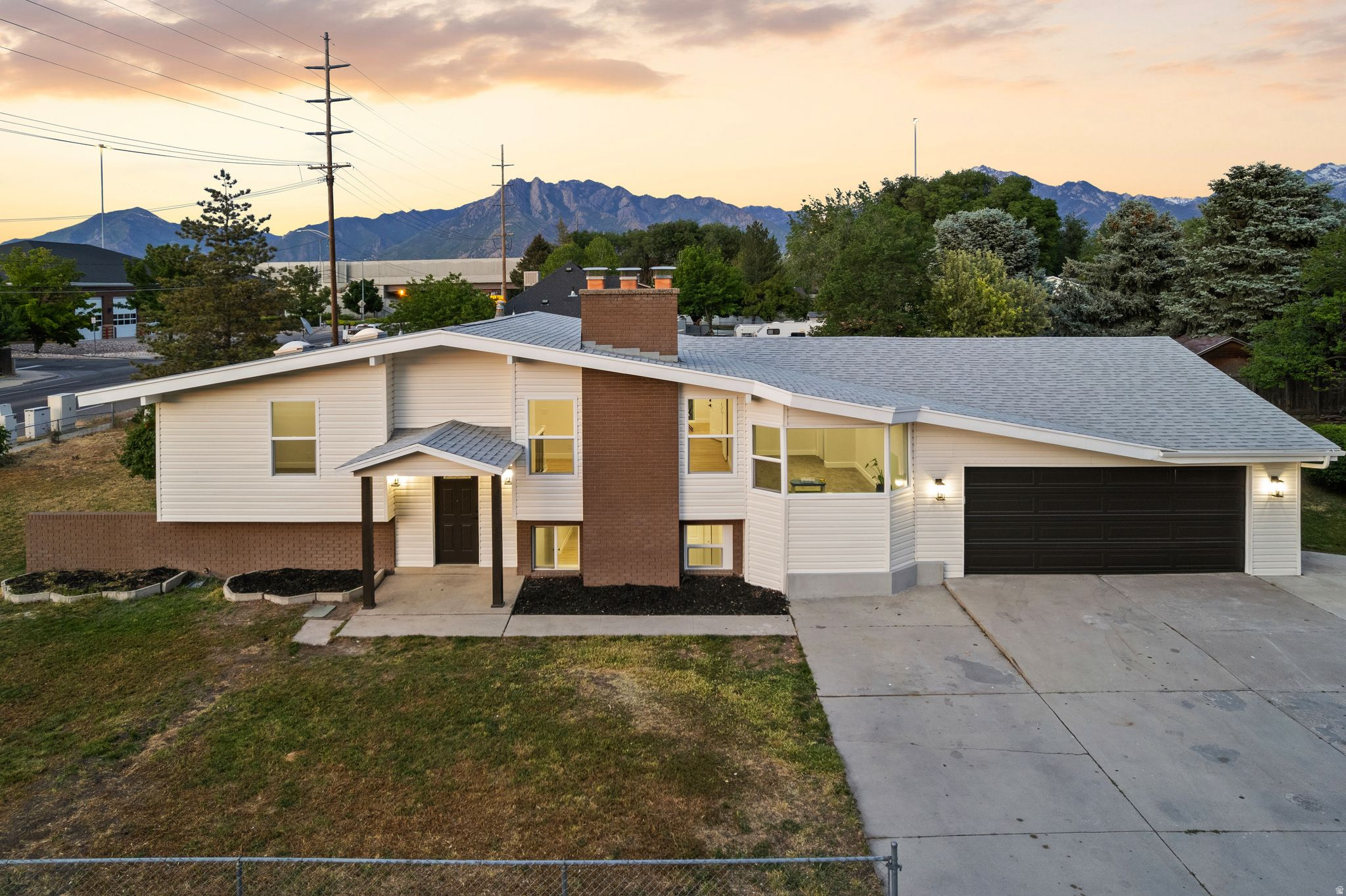 This beautifully updated home combines modern design, flexible living space, and an unbeatable location. The vaulted ceilings create an open and spacious feel from the moment you walk in, while the updated kitchen features brand-new stainless steel appliances, including a gas range with air-fry mode and a large-capacity dishwasher with a third rack. Major improvements have already been taken care of, including the roof, central air system, and water heater, all updated within the last few years. Step outside onto the brand-new Trex deck, perfect for grilling, entertaining, or relaxing outdoors. The basement offers excellent ceiling height and includes a brand-new second kitchen with a walkout entrance, creating ideal potential for an in-law suite, house hacking opportunity, or rental income. Laundry hookups on both levels make it easy to separate the spaces for added flexibility and privacy.Storage is abundant throughout the home with multiple closets on both levels, an oversized garage, and additional RV parking outside. Don't miss the fun "Harry Potter room" tucked away for extra character and charm. The front yard sprinkler valve and timer have also been updated and are ready for your landscaping vision. Located just minutes from I-15, Costco, IHC Hospital, Fashion Place Mall, and only about 10 minutes from downtown Salt Lake City, this home offers convenience in every direction. With modern updates, income potential, generous storage, and a prime Murray location, this property is an incredible opportunity that won't last long. Schedule your showing today  Square footage figures are provided as a courtesy estimate only and were obtained from county records.  Buyer is advised to obtain an independent measurement.