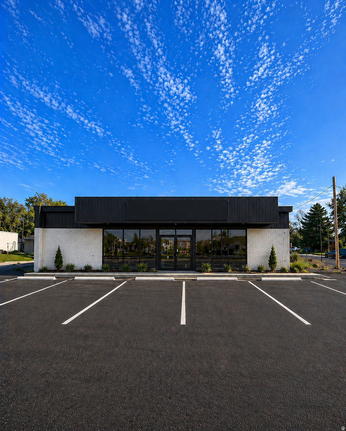 **Seller Financing Available** Positioned on a high-traffic corner at 40th Street and Madison Drive in South Ogden, this standalone commercial building offers exceptional visibility and access in one of the area's busiest corridors. Formerly a gas station, the property has already undergone significant due diligence and planning, including a Phase I Environmental Site Assessment and electromagnetic survey confirming removal of prior fuel tanks. The site has been fully engineered with architectural plans submitted to and approved by the city, allowing a buyer to move forward immediately and pull permits without delay. Approved plans call for conversion into six individual salon or creative suites, catering to the growing demand for independent beauty, wellness, and service-based professionals, with estimated rents ranging from $900$1,200 per suite, providing strong income potential. In addition, substantial site work has already been completed, including new power service with both interior and exterior panels installed, the building trenched and ready for plumbing, and the interior fully gutted to allow for an efficient buildout. This is a rare opportunity to acquire a highly visible corner property with completed environmental work, full approvals in place, and a clear path to development, ideal for investors or owner-users seeking a project with minimized risk and significant upside.