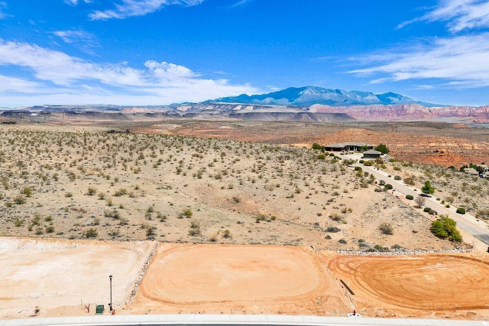 Interior view lot with exceptional views overlooking the city, mountains, Pine Valley, red rock mesas, Sand Hollow, and even Zion National Park! Best suited for a rambler or 2 story floor plan, this lot is located in the final phase of Grand Heights, the highest elevated subdivision in St. George proper, nearly 500 feet higher than the rest of town, including Stone Cliff and Foremaster, offering unmatched views. Enjoy quick access to downtown, hiking and biking trails, and off-road adventures, plus you're just 15 minutes from two major fishing reservoirs and over half a dozen top-rated golf courses. With BLM land bordering the subdivision, you can ride bikes and ATVs straight from your doorstep. Numerous oversized lots are available with convenient highway access. Bring your own builder! Buyer is responsible for water impact fees. All construction requires prior review and approval by the architectural control committee. Buyer to verify all information, deemed reliable, however buyer to verify all info including utilities & ACC information if applicable.