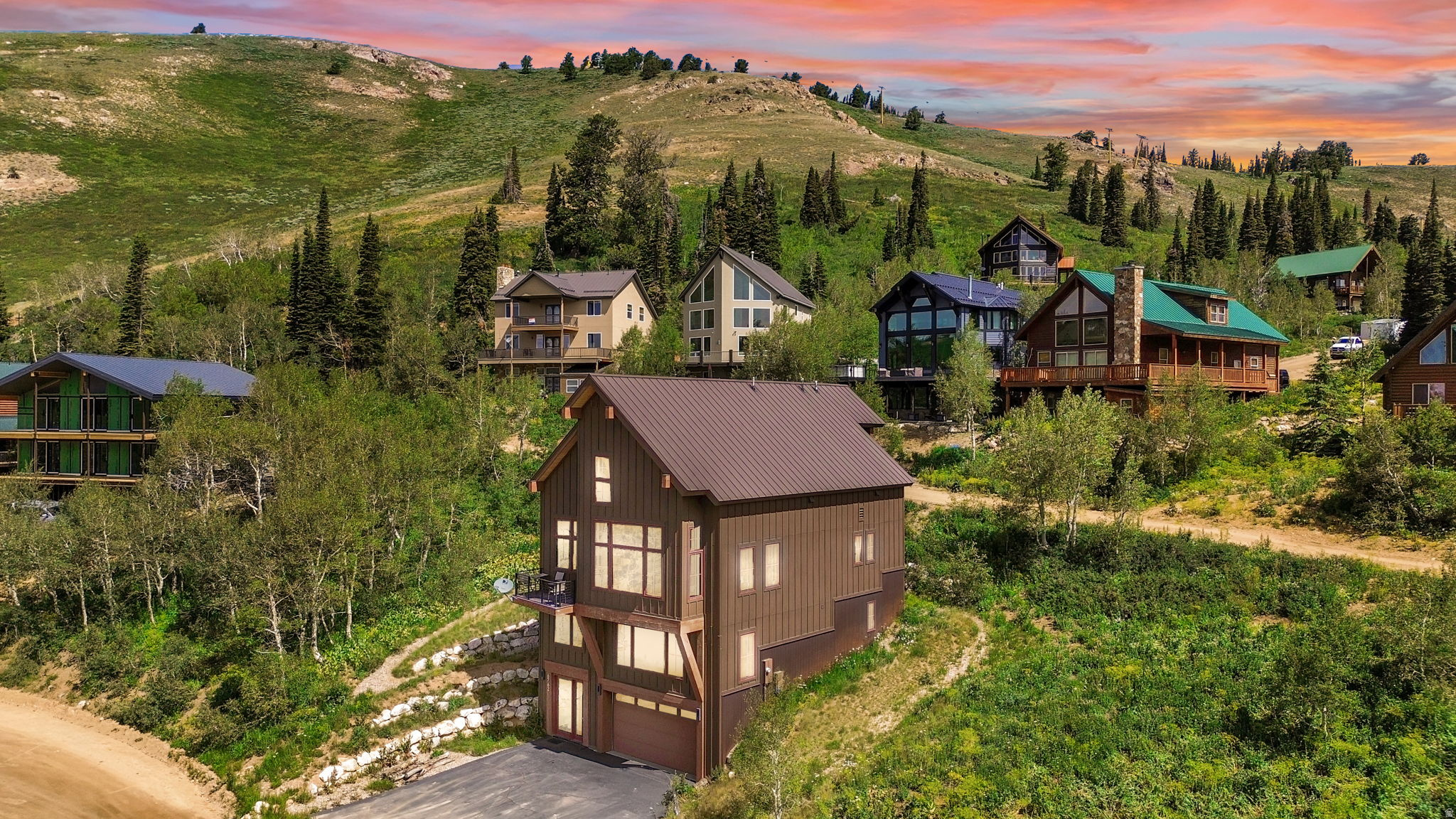 Experience unparalleled ski-in/ski-out access and breathtaking vistas at Powder Mountain Ski Resort. This elegant mountain modern cabin serves as an ideal base for immersing oneself in the full spectrum of Powder Mountain's offerings. Renowned globally for its uncrowded slopes and abundant fresh powder during winter, the property also provides direct access to miles of hiking and biking trails for summer exploration, establishing a year-round recreational haven. Featuring four bedrooms, four bathrooms, and an expansive entertaining area complete with a custom floating fireplace, this residence offers ample space for hosting family and guests.