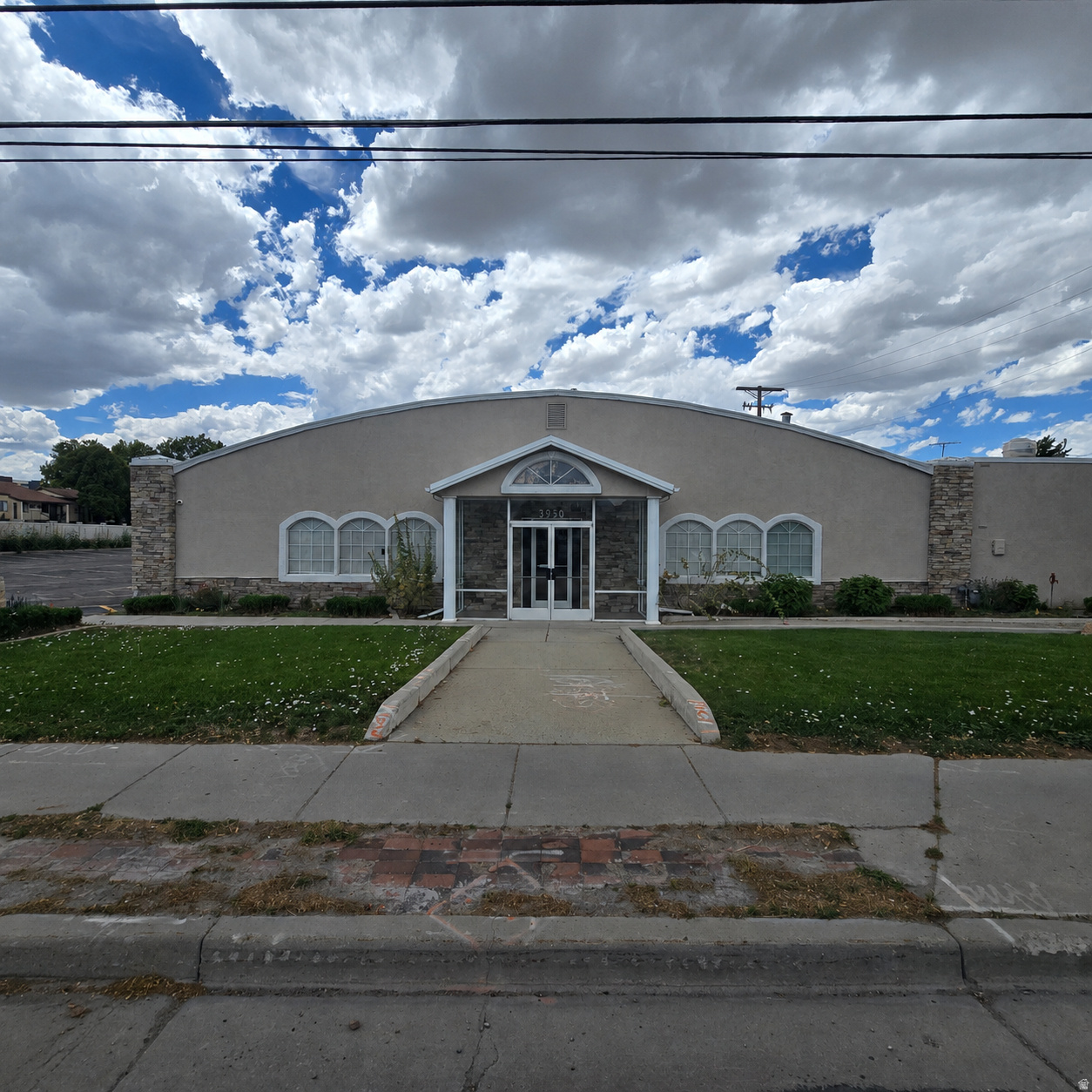 High-visibility church/assembly property located directly on the Redwood Road corridor. This approximately 10,950 square foot building has a one-year-old appraised value of $1,920,000 and offers a strong opportunity for an owner-user, nonprofit, religious organization, office user, retail/showroom operator, event operator, or investor seeking a well-positioned property with excellent exposure.  Currently used as a church, the property is located in West Valley City's C-2 commercial zone, which allows for certain retail and office uses, along with other commercial possibilities subject to city requirements. The existing assembly-oriented layout may also offer potential for continued religious use, reception or event center use, community services, education/training, counseling, wellness, professional office, showroom, or adaptive reuse/redevelopment.  The location provides strong visibility, consistent corridor traffic, and convenient access to surrounding residential neighborhoods, commercial services, and major transportation routes. A rare opportunity to secure a sizable commercial/assembly property in a prominent west-side location with flexible future-use potential.  Buyer to verify zoning, permitted uses, conditional-use requirements, parking, occupancy, appraisal information, building condition, traffic counts, and all city requirements. Buyer and representative to verify all information.