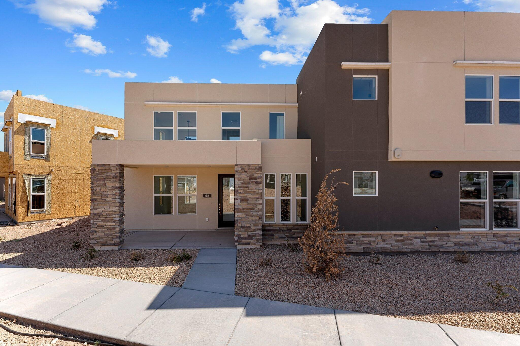 Come live where it feels like a vacation every day!  Our popular Sunburst townhome duplex in the highly sought after Desert Color community!  Beautifully designed with soaring 20 ft ceiling and large windows creating an open feel & filling the home with natural light. Stylish modern  selections.  Large bedrooms, large 2 car garage with extra wide driveway + extra parking spaces.  located on a quiet street just steps from a neighborhood park and the new community pool. Enjoy access to the stunning 2.5 acre lagoon, sand volleyball, pickle ball courts, resort-style pools. & walking trails. Come see why Desert Color has become one of St. George's most desirable communities! Live the dream!