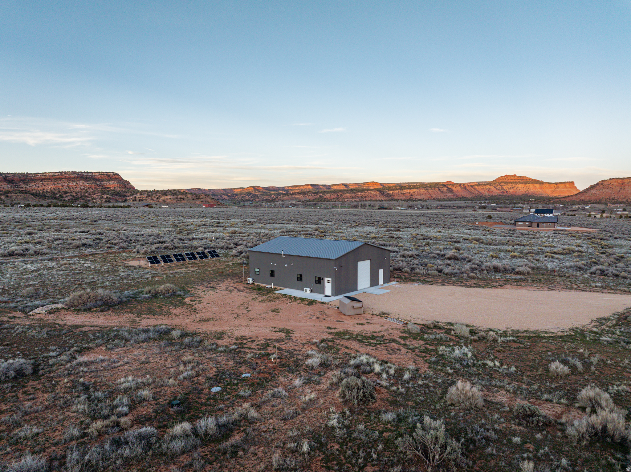 One of the best and highly sought after 10 acre lots left in Kanab with stunning views from every angle. 2,000 sq. ft. barndominium that includes a 770sq. ft. apartment inside with 770 sq. ft. of storage above the apartment. Live in your barn while you build your dream home next door. Insulation is a combination of closed cell spray foam along with conventional bat insulation. This is one tight and energy efficient apartment. Brand new appliances with stackable washer and dryer. Electric water heater and new water softener. The latest in solar off grid technology installed with the ability to upgrade by simply plug and play EG4 all in one inverter and EG4 wall mount batteries. You can expand the system up to 16 inverters and 7+ batteries. EG4 inverter " 8 kw of PV / EG4 battery "14.3 kw of storage. (14) 395 watt panels still in the box to expand your system for your dream home or hook up to the grid and sell back your unused energy. Barndominium is pre-wired for generator. Septic is already installed along with Kane County water. Starlink internet already installed along with a cell phone single booster. Priced below replacement cost.