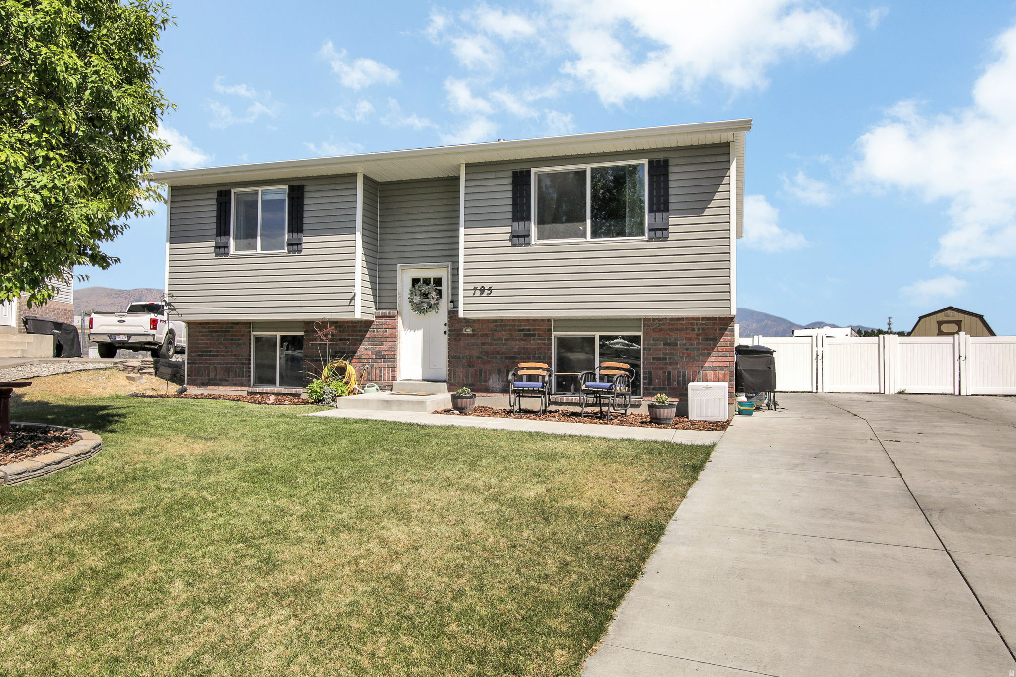 Welcome home to the perfect blend of comfort, space, and small-town living. This beautifully maintained 4-bedroom, 2-bath home sits on a spacious quarter-acre lot and offers 1,687 square feet of bright, inviting living space designed for making memories.  The open floor plan is perfect for gathering with family and friends, while the daylight basement provides flexible space for a family room, home office, or play area. Outside, enjoy room to garden, entertain, or simply relax under Northern Utah's wide-open skies. A 3-car garage offers plenty of storage for vehicles, tools, and all your outdoor gear.  Built in 2015 and thoughtfully cared for, this move-in-ready home includes active solar, central air, and a peaceful neighborhood close to schools, parks, and everyday conveniences.  Whether you're starting your next chapter or growing your family, this home offers the space, warmth, and western lifestyle you've been looking for.