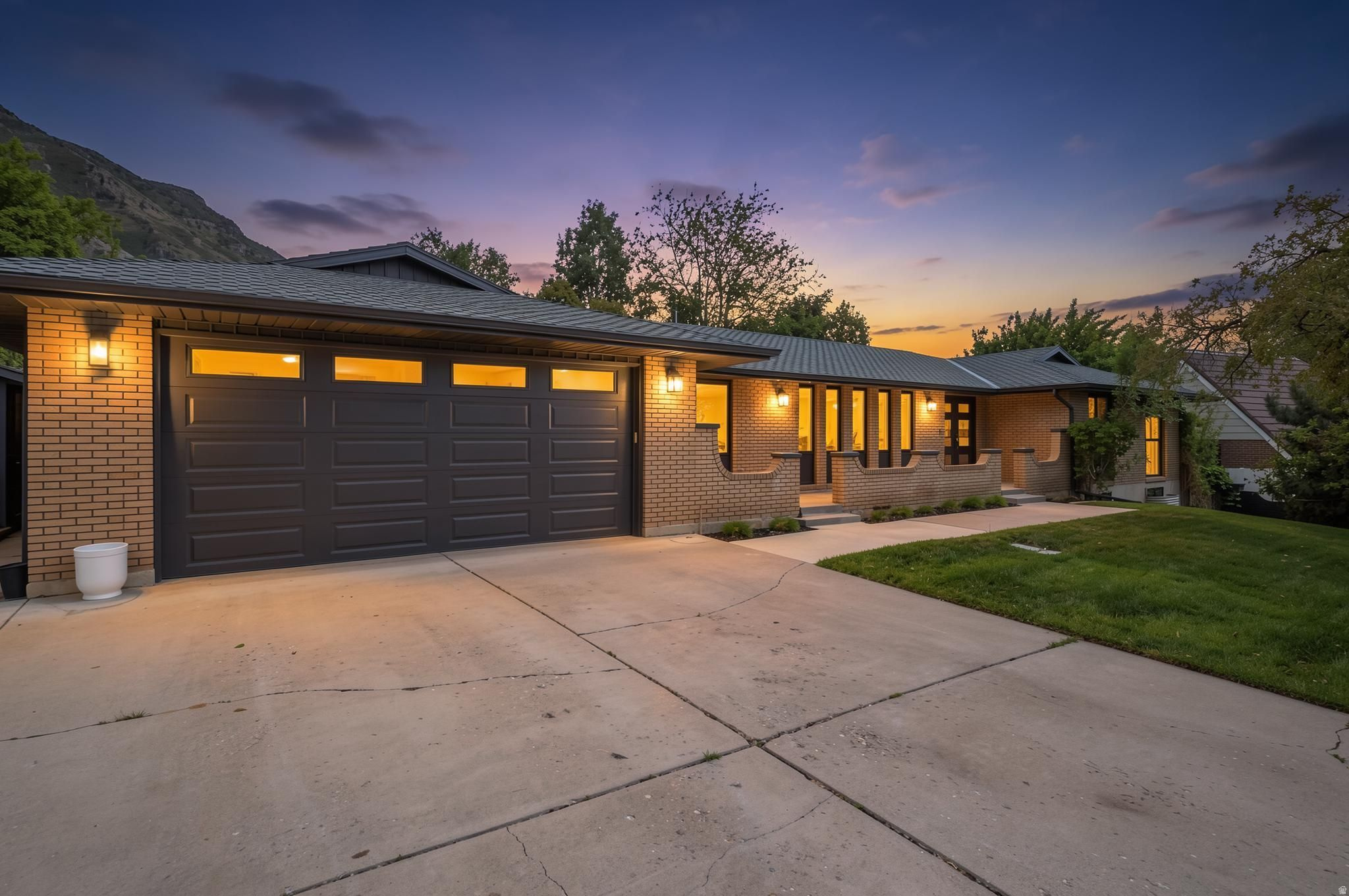 This beautifully remodeled home is located in one of Provo's most desirable neighborhoods, just minutes from BYU, major shopping, local parks, and only 5 minutes from Provo Canyon access. Combining comfort, space, and convenience, this home offers the perfect setting for both everyday living and entertaining. The fully updated and recently remodeled kitchen is the heart of the home, featuring modern finishes, updated cabinetry, and a functional layout perfect for gatherings and daily living. The main level also features fresh new carpet in all three bedrooms and on the stairs, along with a cozy fireplace that adds warmth and character to the living space. The spacious floor plan continues into a fully finished basement complete with a second kitchen, expansive entertaining space, a second fireplace, two additional bedrooms, and a full bathroom - ideal for guests, multi-generational living, or potential rental opportunities. Outside, enjoy a private, fully fenced backyard with two decks, a cement patio, mature trees and landscaping, RV parking, and stunning mountain views. With plenty of space to relax and entertain both inside and out, this exceptional property offers comfort, flexibility, and an unbeatable location in the heart of Provo!
