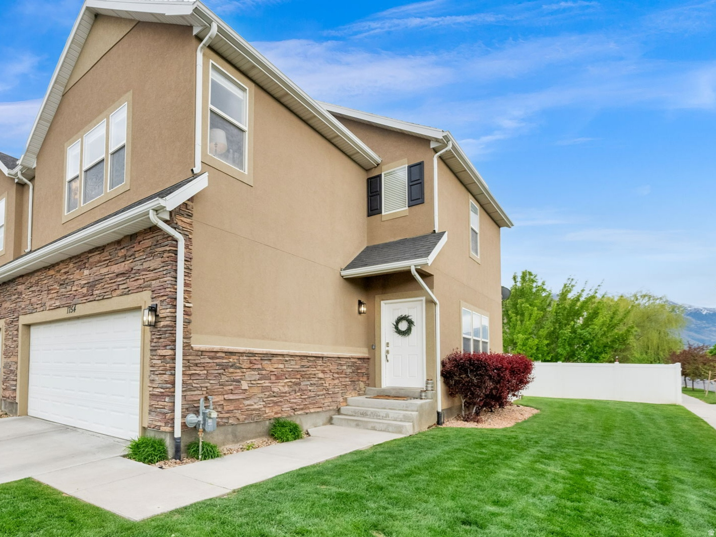 Beautifully maintained end-unit townhome just minutes from Spanish Fork Canyon, offering 3 bedrooms and 3 full bathrooms with an abundance of natural light throughout. This fully finished home features updated flooring in the kitchen, bathrooms, and laundry room, along with refreshed kitchen and bathroom cabinets, updated recessed lighting, and a new sink and faucet on the main floor. The kitchen is equipped with a new double oven range, and all appliances are included-refrigerator, washer, dryer, dishwasher, and microwave-making this home truly move-in ready.  The spacious primary bedroom offers a large, open layout with two walk-in closets-one featuring a built-in micro office-and a separate private bathroom. A Jack-and-Jill bathroom connects to a generous secondary bedroom with its own walk-in closet, providing functional and flexible living space. Step outside to a private back patio with a gated entrance to extended community green space, perfect for outdoor entertaining. Additional features include upper garage storage and a spacious 2-car garage, along with a large basement family room offering additional living space.  Located near parks, a dog park, splash pad, and an all-abilities park, with a new state-of-the-art recreation center and a modern library offering incredible programs for all ages. This home combines comfort, convenience, and access to everything you need for an active and connected lifestyle.