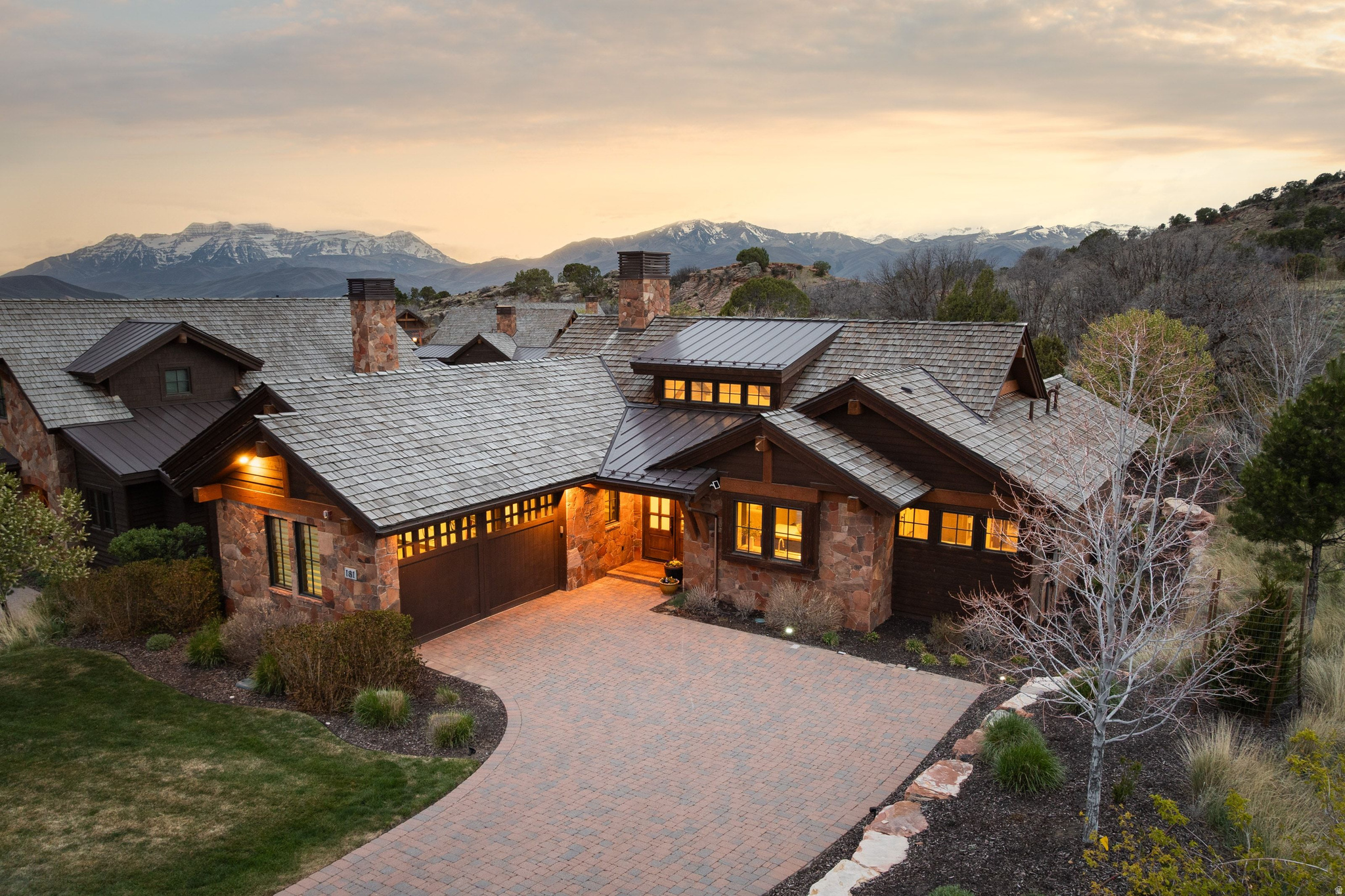 Welcome to your dream mountain escape in one of the most sought-after gated communities in the region. This stunning 3-bedroom, 3.5-bath home offers the perfect blend of luxury, comfort, and convenience, all just 12 minutes from the new East Village. Designed with entertaining in mind, this residence boasts expansive indoor and outdoor living spaces, including a cozy fireplace and an inviting firepit, ideal for gathering year-round. Soak your cares away in the private hot tub while enjoying panoramic mountain views, including the iconic Red Ledge. Each of the three spacious bedrooms features its own en-suite bath, ensuring privacy and comfort for family and guests alike. Rich hardwood floors, a heated garage, and tasteful finishes throughout elevate the home's warm, welcoming atmosphere. Located within walking distance to pools, tennis and pickleball courts, and the renowned Jack Nicklaus Signature Golf Course, you'll also enjoy access to the award-winning 10,000 sq ft Wellness Center, Golf Park, Equestrian facilities, Ski Shuttle service, and three exclusive clubs in Deer Valley. All Memberships options are available, adding even more value to this one-of-a-kind property. Whether you're enjoying a gourmet meal at the clubhouse restaurants or perfecting your swing at the Golf School, this community offers every amenity for an active and sophisticated lifestyle. Don't miss the opportunity to make this luxurious mountain haven your own.