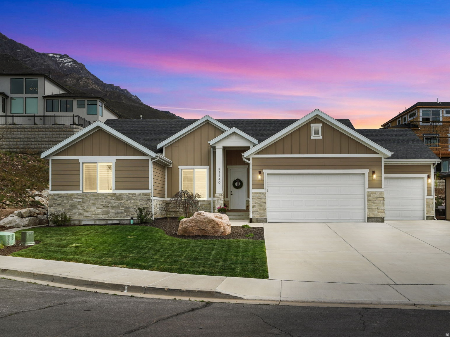 Welcome Home to this gorgeous rambler that truly has it all! Designed with quality finishes for comfort and convenience. Main level features: *Spacious primary suite, *Private office, *Two additional bedrooms, *Laundry room for easy single-level living, amazing kitchen with: *Large quartz island, *Beautiful cabinets and marble backsplash, *Abundant natural light, *Warm toned wood-type LVP flooring *Gas fireplace with marble tile *Inviting spaces perfect for gathering. Backyard offers: *Brand-new covered deck, *Breathtaking sunrise and sunset views. *Tiered yard with drip system ready for planting. Basement offers: *Large family room, *Tons of storage, *Water softener *ADU with private exterior entrance (ideal for guests, multi-generational living, or rental income). *Oversized 3-car garage with extra-deep bay (24'3" long x 11'4" wide). *Radon Mitigation System Installed *Located in a quiet neighborhood with stunning views all around. (And the neighbor is willing to sell the lot to the east if you want more land!) This is an exceptional home you won't want to miss-schedule your tour today!