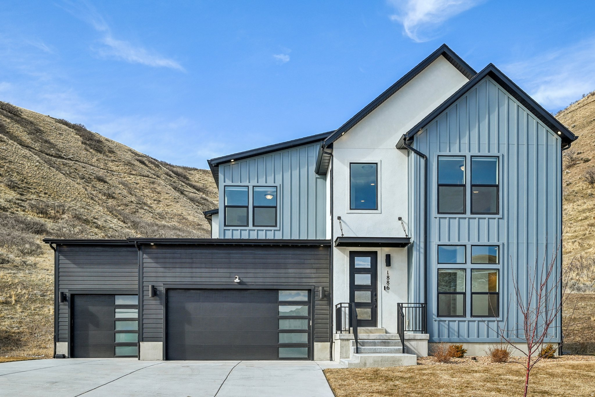 Set on a .46-acre lot in Lehi's Canyon Point community, this 2022-built home brings modern living with a little more breathing room. Enjoy mountain views, open gathering spaces for everyday life, and a finished lower level ready for movie nights, guests, workouts, or whatever your calendar is currently demanding. With 6 bedrooms, a main-level primary suite, 3-car garage, and access to community trails, clubhouse, gym, and pool, this home delivers comfort, space, and convenience near Traverse Mountain, Silicon Slopes, shopping, dining, and commuter routes. Clean, bright, and refreshingly easy to love.