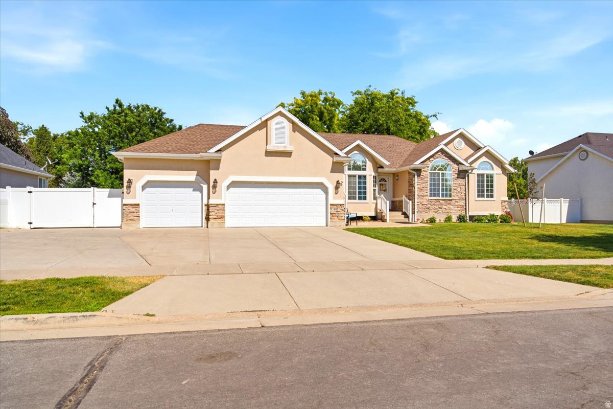 Welcome home to this beautiful rambler, which features six bedrooms, three and a half bathrooms, and a fully finished basement with a second kitchen, offering excellent flexibility for multi-generational living, guests, or entertaining. The open-concept floor plan showcases vaulted ceilings, abundant natural light, hardwood flooring, and a blend of granite and quartz countertops throughout. Situated on a fully landscaped .33 acre lot, this home also features RV parking, a three-car garage, a fully fenced backyard, a storage shed, and mountain views. With generous living space, quality finishes, and exceptional functionality, this move-in ready home is one you won't want to miss.  Square footage figures are provided as a courtesy estimate only.  Buyer is advised to obtain an independent measurement.