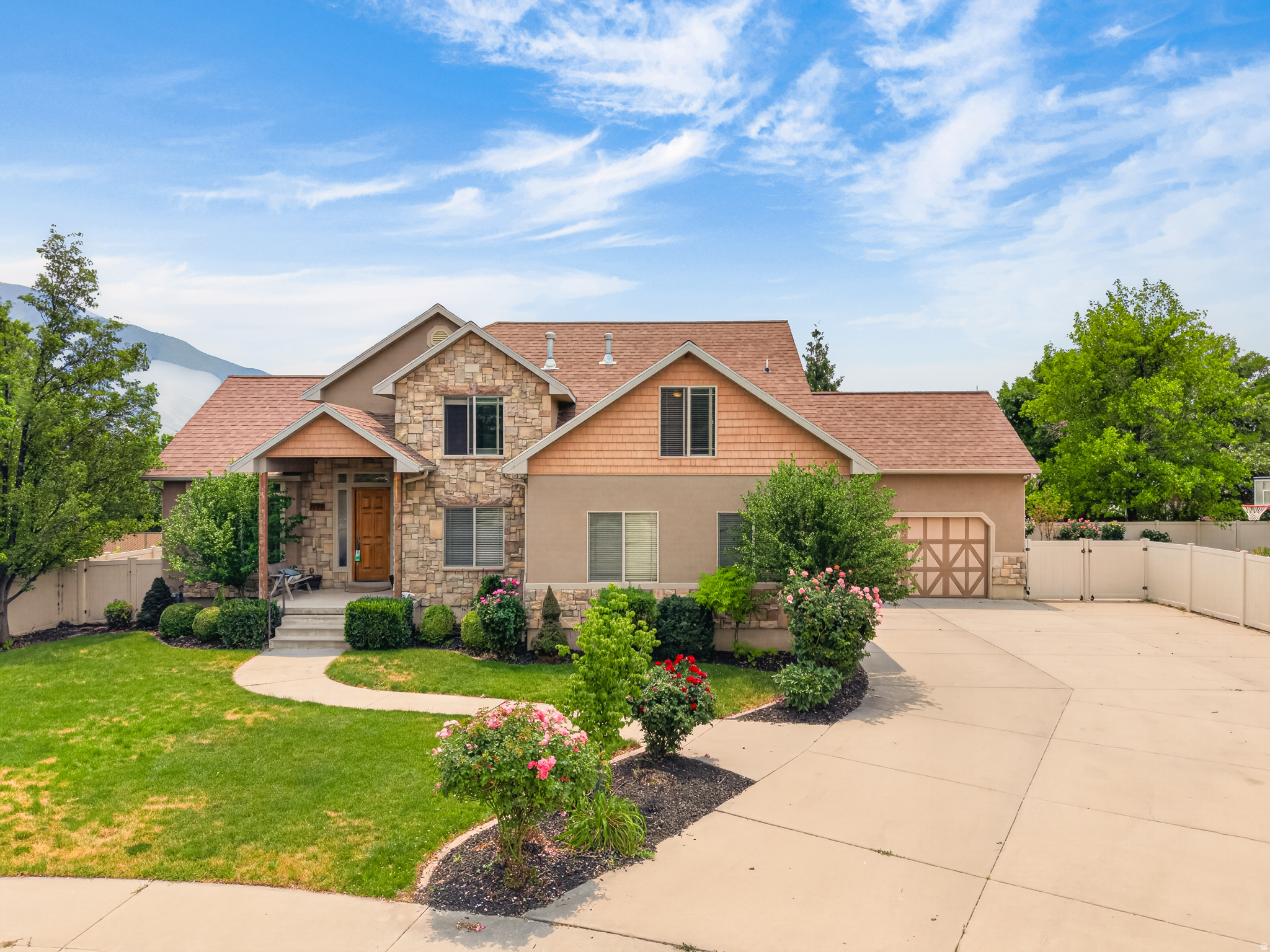 Welcome to this beautifully maintained home nestled in one of Mapleton's most desirable neighborhoods. Built in 2005 and offering over 4,600 square feet of thoughtfully designed living space, real hardwood flooring, and a 4 car garage, this home delivers the perfect blend of comfort, functionality, and Utah Valley charm. Set on a generous 0.34-acre lot, there's plenty of room to enjoy Utah's stunning outdoor lifestyle. If having a small hobby farm is part of your dream, this space is already set up with a chicken coop, rabbit pen and still has plenty of space to let the kids run, and soak in the breathtaking views of Maple Mountain. Inside, the expansive floor plan provides flexibility for large families, multigenerational living, or those who simply want room to spread out. Conveniently set up so that the basement could easily be closed off to add an ADU with a completely separate entrance that could be rented out. Six true bedrooms offer space for everyone, while four baths mean no one's waiting in line. The open layout creates a natural flow between living, dining, and kitchen spaces, and the home's size leaves room for formal living, a home office, or a dedicated playroom, the choice is yours. Located in Mapleton City, you'll enjoy the peace and privacy of a small-town feel with quick access to Spanish Fork, Springville, and the broader Utah County corridor. Top-rated Nebo School District, easy freeway access, and proximity to trail systems and outdoor recreation make this an exceptional place to put down roots. Homes like this, with the space, lot size, and location this property offers, don't come available often in Mapleton. Schedule your private showing today.