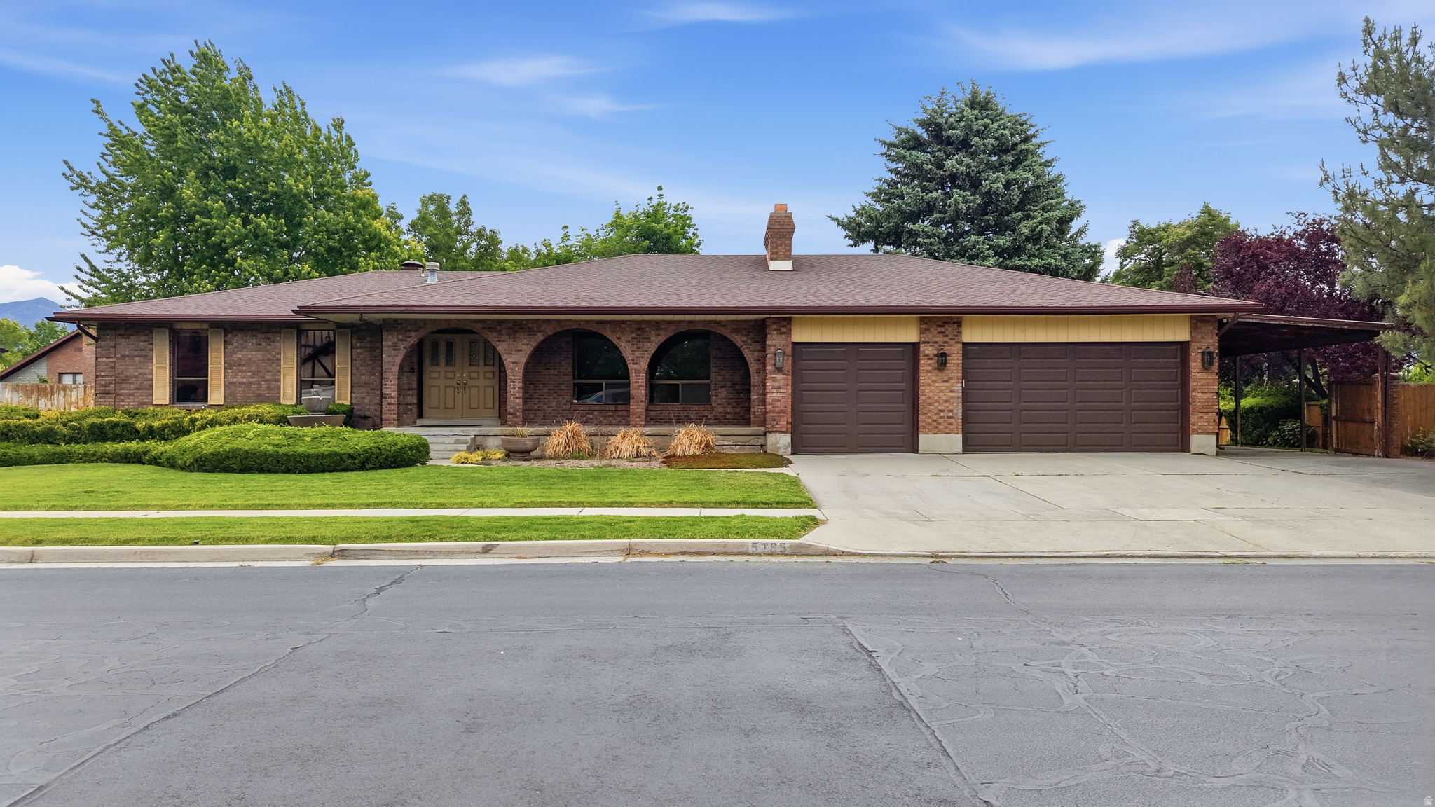 A floor plan way ahead of its time. This one-owner all-brick rambler offers space, flexibility, and opportunity. Designed for multi-generational living long before it was common, the home features two primary suites, one on each level, plus separate basement access with strong ADU potential.  The layout offers generous living spaces with an easy flow that works well for both everyday living and entertaining.  Major big-ticket systems have already been updated, including a newer roof (approx. 2016), HVAC system (2021), water heater (2023), and newer appliances, giving peace of mind and a strong starting point for the next owner.  Set in a well-established area known as The Old Erekson Dairy Subdividsion, the location and lot size with its mature trees is a rare find. This property delivers solid construction, a modern day functional layout, and meaningful upgrades already in place, leaving room to personalize this home to make it your own.  Square footage figures are provided as a courtesy estimate only and were obtained from an appraisal.  Buyer is advised to obtain an independent measurement.