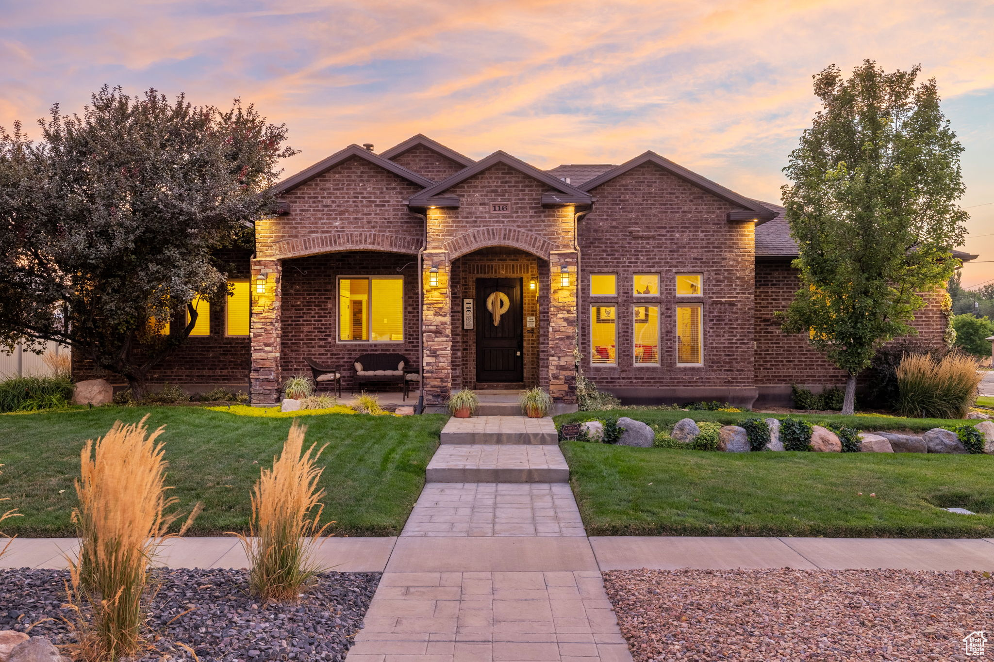 Mountain Tuscan retreat designed for long-term durability and everyday comfort, featuring a grand entry, extra-wide hallways, and 10' main-level ceilings. Engineered maple hardwood floors (like new), deep-sill windows, and upgraded trim bring warmth and natural light throughout. | Kitchen/Great Room: Large island with storage on all sides, dual ovens (gas + electric), gas range with full vent hood, plus adjacent flex room ideal for a butler's pantry or office; great room with wood-burning fireplace with heat distribution. | Primary/Laundry: Spacious primary suite with double vessel sinks, jetted tub, and spa-style shower with body sprays + rain head; main-floor laundry designed as a true workspace. | Construction/Systems: Built with ICF (Insulated Concrete Forms) for strength, energy efficiency, and a quiet interior; central climate control and a 75-gallon water heater. | Basement/MIL: Separate entrance with mother-in-law apartment (second full kitchen) plus two theater-ready rooms pre-wired for 5.1 and 6.1 surround/stadium seating; high-end stamped concrete window wells. | Outdoor/Garage: Covered patio wired/plumbed for outdoor kitchen (natural gas + hot/cold stubs), mature fruit trees, fenced yard with established lawn and xeriscaped parking strips; 13' garage ceilings with work area, utility sink (hot/cold), abundant storage, and room for RV/boat/toys off-street (garage doors could be raised to 10'+; potential for additional bay). Detached garage could be added to the west of existing garage. | Extras/Location: CentraCom fiber, whole-house audio wiring, Ethernet LAN ports, smart irrigation, and water filtration. Near schools, parks, dining, golf, theater, hospital, and minutes to freeway access. | Disclosure: Square footage per appraisal sketch; buyer advised to obtain independent measurement.