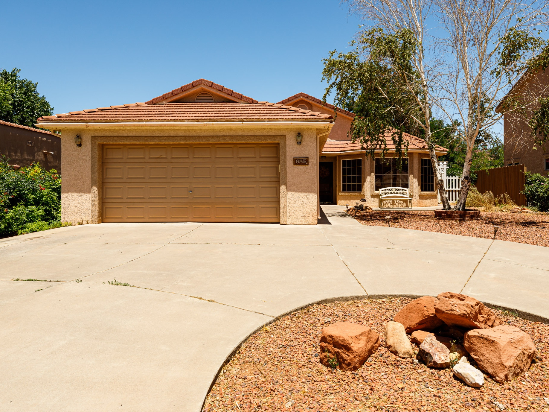 Enjoy single-level living in this spacious 4-bedroom, 2-bathroom home nestled in the desirable Red Shadow Circle subdivision. Step inside to a welcoming great room with vaulted ceilings that flows into the open-concept kitchen and dining area, ideal for everyday living and entertaining. The floor plan offers separation between living areas and bedrooms for comfort and privacy. The primary suite features direct access to the laundry room, with a second laundry entrance, plus additional storage and a mudroom off the garage create added convenience. Located on a quiet cul-de-sac, this home offers both privacy and an in-town location; close to schools, shopping, and dining. Short-term rentals are allowed, offering flexibility and investment potential. Enjoy a private, shaded backyard with mature trees, accessible from the dining area and a bedroom. The backyard is fully fenced and ideal for pets and outdoor living. A detached storage shed provides space for hobbies, gardening, or extra storage. A well-designed home offering comfort and functionality, ideally located in the heart of Kanab, Utah. (Buyer to verify all)