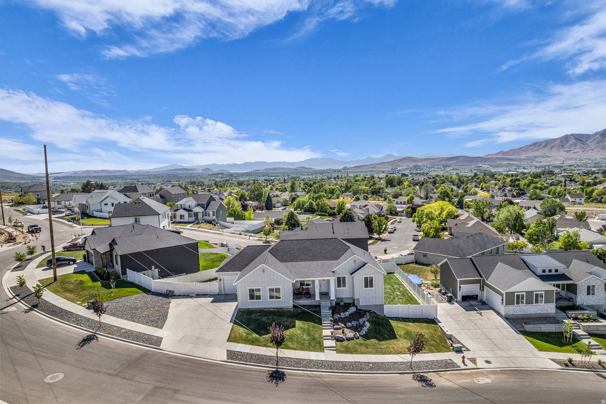 Beautifully maintained 3-year-old rambler located in the highly sought-after Payson View Estates community. Enjoy breathtaking panoramic views of both the valley and surrounding mountains right from your home. This property features numerous upgrades throughout, including high-quality laminate flooring, quartz countertops, craftsman-style, ceiling-height cabinetry, creating a modern yet warm and inviting feel.  Skip the hassle and added expense of new construction with a fully landscaped yard and complete fencing already in place. All appliances are included in the purchase and washer/ dryer are negotiable! Home has a front office that can become a bedroom easily if needed. The daylight basement provides abundant natural light and offers endless possibilities for additional living space, a rental opportunity, or a custom finish to suit your needs.  This home combines comfort, quality, and convenience, schedule your showing today!