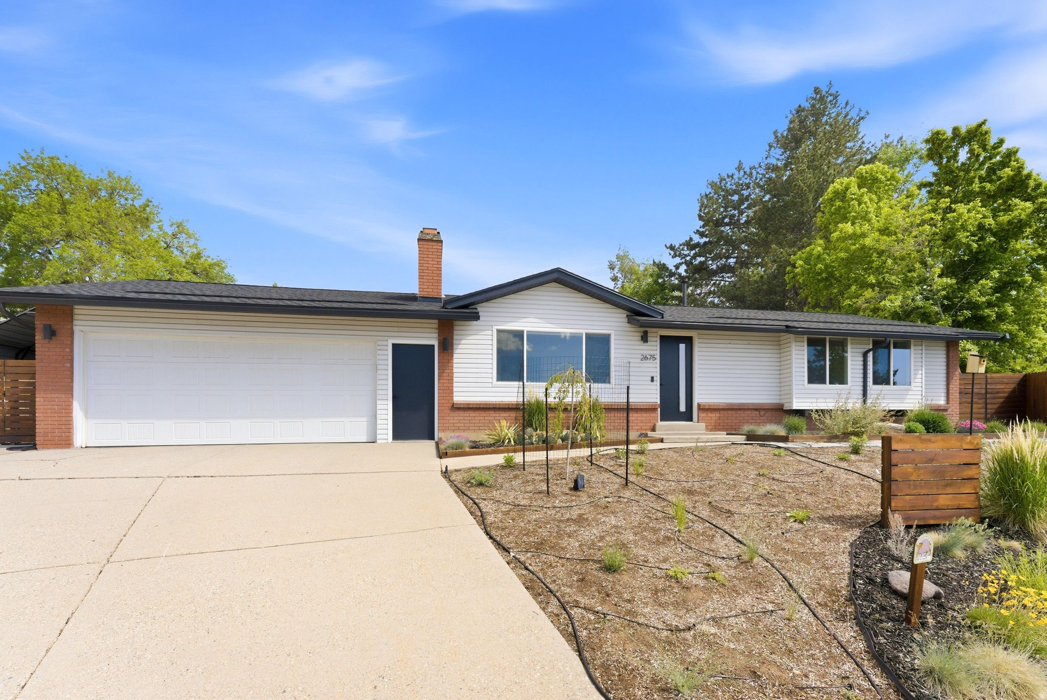 Walkable distance to Mueller Park trails  Cul-de-sac lot  Mountain and lake views  RV parking with separate basement entrance. This East Bountiful rambler offers 5 bdrms 3 baths on a 0.25-acre lot. The kitchen features granite countertops, stainless steel appliances, a gas range, and reverse osmosis water system. Hardwood floors, a wood-burning fireplace, updated bathrooms, and a main-level primary suite add to the home. The finished basement includes an oversized bedroom with walk-in closet, separate backyard entrance, and washer/dryer hookups for added flexibility. Major updates include dual furnaces and dual A/C units replaced in 2025, roof replaced July 2025, and electrical panel replaced July 2024. Additional features include a tankless water heater, water softener, vinyl windows, oversized 25-foot carport, built-in gas BBQ, mature trees, fenced yard, and RV parking