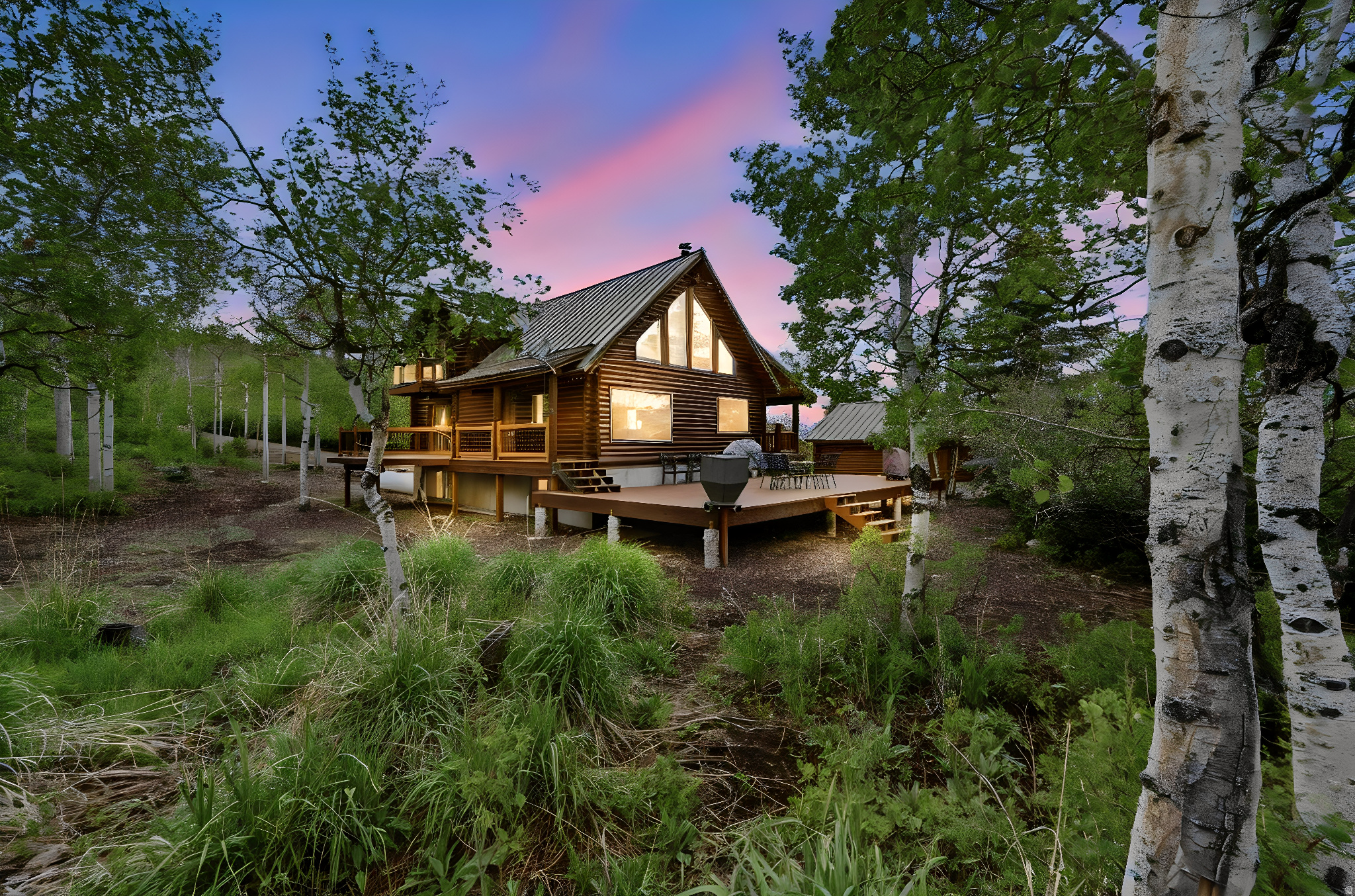 Discover your own private mountain paradise with this extraordinary log cabin retreat nestled on a rare double 2.4-acre lot, offering exceptional privacy, peaceful surroundings, and trails woven throughout the property for endless exploration and adventure. Imagine spending your mornings on the expansive Trex deck watching wildlife wander through the trees while soaking in the beauty and tranquility of the great outdoors. Extremely well cared for and thoughtfully maintained, this mountain escape showcases a newly refinished log exterior and is truly move-in ready, sold furnished so you can begin making memories from day one. Inside, stunning windows frame the surrounding landscape and flood the home with abundant natural light, while soaring vaulted tongue-and-groove ceilings create the perfect mountain ambiance. The inviting kitchen features beautiful granite countertops and stainless steel appliances, blending style and functionality. Outside, enjoy a spacious and flat setting, a detached 2-car garage, ample parking for guests and recreational toys, and endless opportunities for year-round enjoyment. This ultimate secluded mountain getaway offers the perfect combination of comfort and adventure.  Enjoy endless outdoor activities and all the wonderful amenities of Park City, Heber, and Midway right at your fingertips! Start making unforgettable memories of your own!