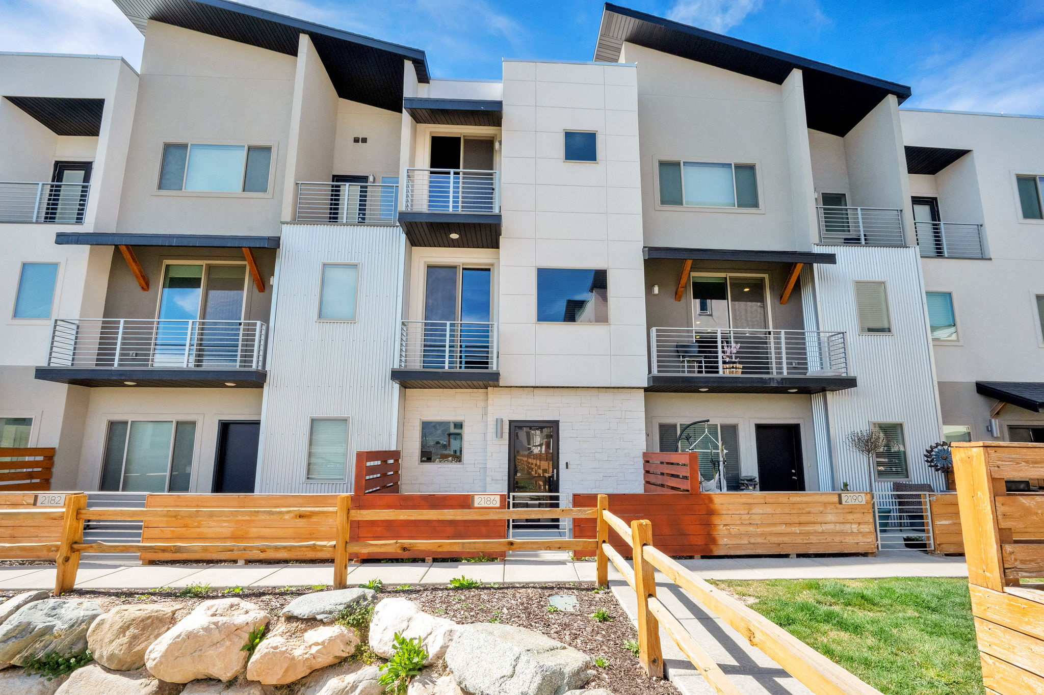 GORGEOUS TOWNHOME W/ MOUNTAIN VIEWS! Beautiful, Completely Upgraded Townhome! Two Master Bedrooms Upstairs w/ Vaulted Ceilings. Grand Master Bath w/ Double Sinks. 9' Ceilings on all Levels, 2 Decks w/ Views, Quartz Countertops, Gas Oven/Range, Refrigerator, Tile Backsplash, Laminate Floors, New Paint, Electric Fireplace, Central Air, LVP Floors, 2 Car Garage. SHOWS GREAT!