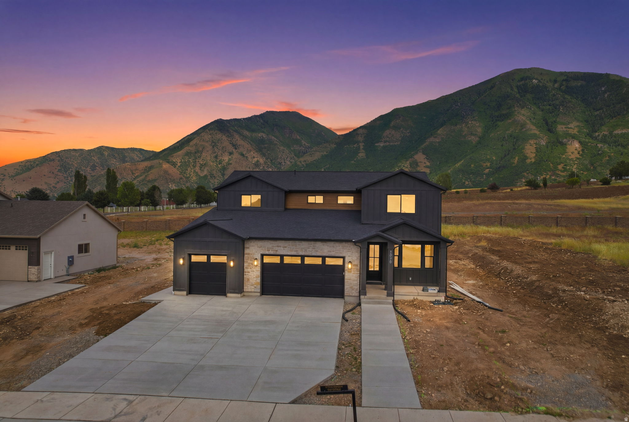 This stunning 2-story new construction just off Woodland Hills Drive offers refined finishes throughout with a thoughtfully designed layout. The home features 4 bedrooms, 3 full bathrooms, and 2 half bathrooms, including a private office on the main level. Enjoy beautiful mountain views, a fully finished expansive basement with space for entertaining, a dedicated gym and a 2 bedroom, 1 bathroom ADU. Front Landscaping is getting done, but the back will be done by whoever buys the home. Get up to $20,000 with a PREFERRED LENDER INCENTIVE to use towards a 2-1 Buy down!