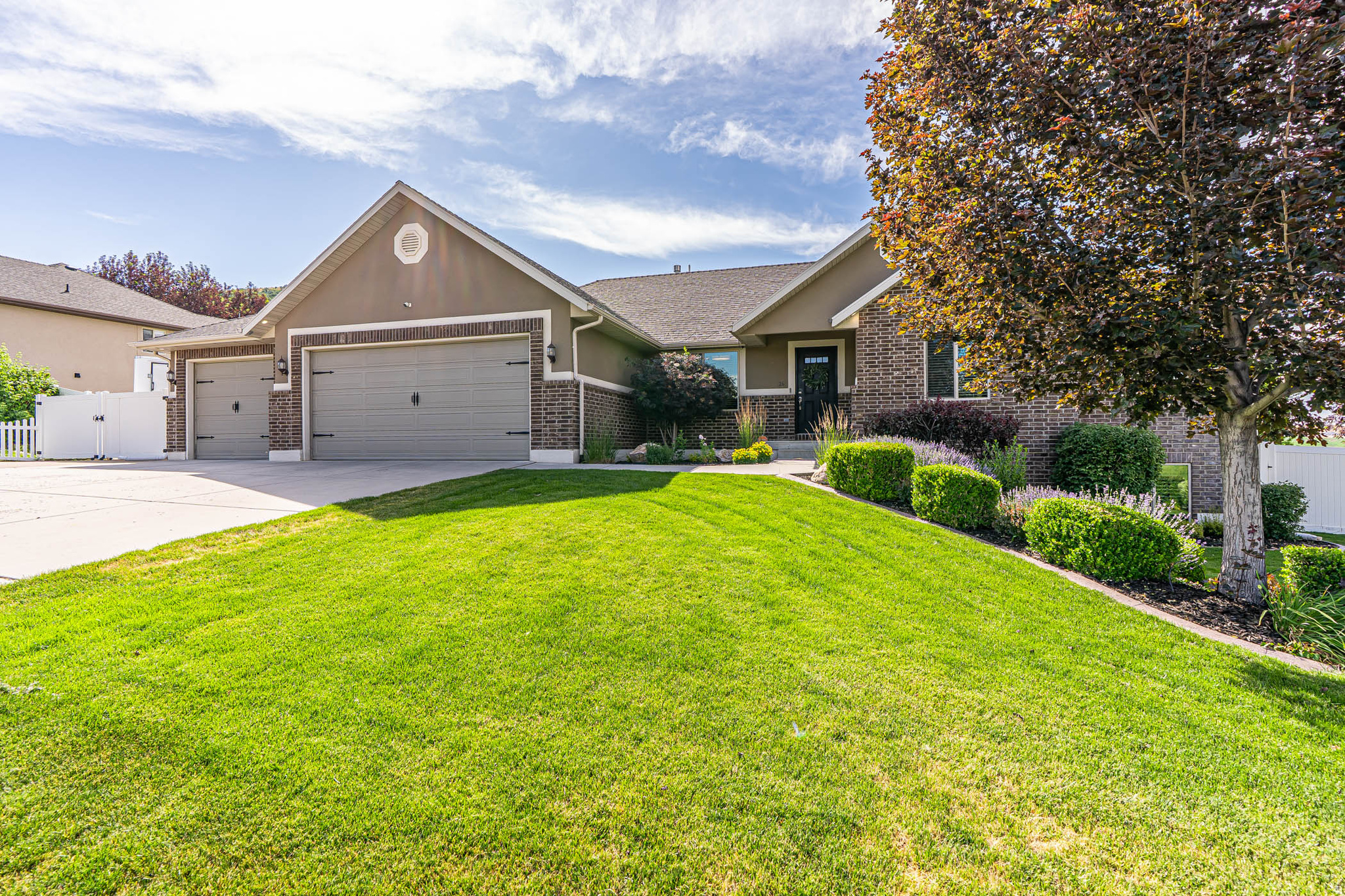 Welcome to the beautiful neighborhood of Wellsville Ranches! This home is loaded with upgrades-from fresh paint, new carpet, and updated lighting to brand-new windows, a recently updated exterior, covered patio with Trex deck and extra parking for your RV. When you move in, everything is ready for you-no work needed. Inside, you'll find three welcoming bedrooms upstairs and three more downstairs, along with a movie room featuring built-in entertainment& surround sound, a cozy den, a large laundry room, and ample storage throughout. And if you love mountain views, this home is truly made for you.