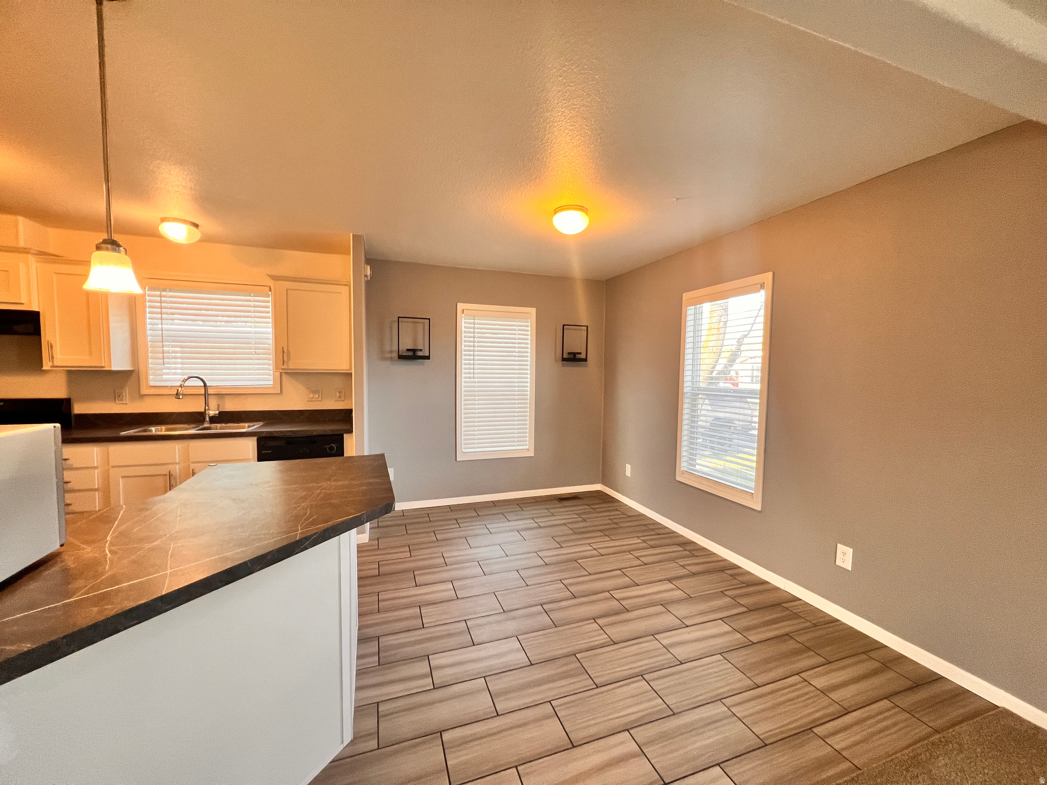 Come see this Certified Pre-Owned (CPO) home! Pre-appraised, pre-inspected, and priced below appraisal, offering added peace of mind and value. Walking-tour video available! This spacious 3-bedroom, 2-bath home is conveniently located in the heart of Riverdale with easy access to shopping, dining, parks, and everyday amenities. Enjoy nearby outdoor recreation along the Weber River corridor, including trails and open green space.  Inside, you'll find a functional layout with comfortable living spaces ready for your personal touch. The property also includes a storage shed featuring built-in workbenches and overhead storage, providing excellent space for tools, hobbies, or additional organization. As an added bonus, the 75-inch big screen TV and 32-inch TV are included with the home.  Conveniently located near commuter routes, retail centers, and recreational opportunities, this home offers both accessibility and lifestyle appeal. Schedule your showing today and see all this home has to offer!  Square footage figures are provided as a courtesy estimate only and were obtained from ______________ .  Buyer is advised to obtain an independent measurement.