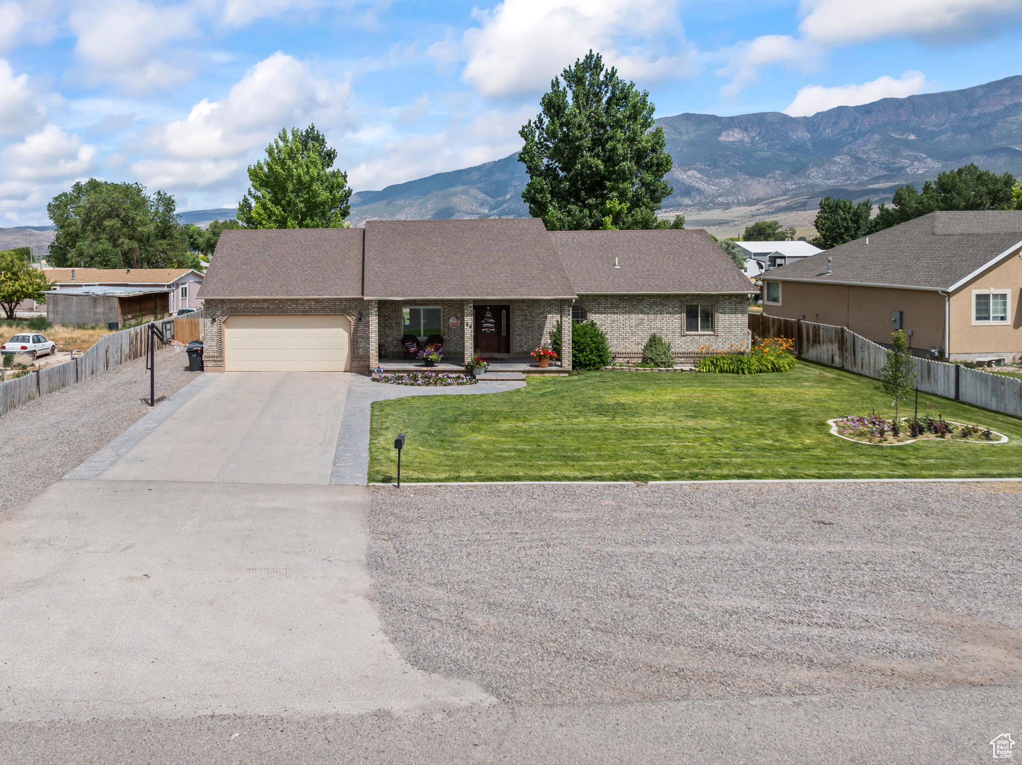 Country Charm Meets Modern Comfort  Updated 4 Bed, 3 Bath Home on .70 Acres in Central Valley, UT  Discover the perfect blend of country living and modern updates in this beautifully maintained 4-bedroom, 3-bathroom home, offering 2,976 sq ft of open-concept living space. Nestled on a generous 0.70-acre lot in the peaceful and charming town of Central Valley, this home is full of warmth, space, and style.  Step inside to a bright, open floor plan designed for comfortable living and effortless entertaining. Enjoy recent updates throughout, including new flooring, countertops, cabinets, and more. The spacious bedrooms provide plenty of room to relax, while multiple storage rooms and a separate basement entrance add flexibility and function. The large oversized garage and mud room make it very nice to park all the vehicles, extra storge, and to clean off before you come in.   The exterior is just as impressive-featuring a flawless, fully fenced and landscaped yard with a full sprinkler system, mature trees, and beautiful curb appeal. The oversized backyard offers ample space for parking trailers, RVs, or creating your ideal outdoor retreat. All of this is set on a quiet, low-traffic street that enhances the home's private, country feel.  This is small-town living at its best-move-in ready, thoughtfully updated, and full of charm. Schedule your private showing today!