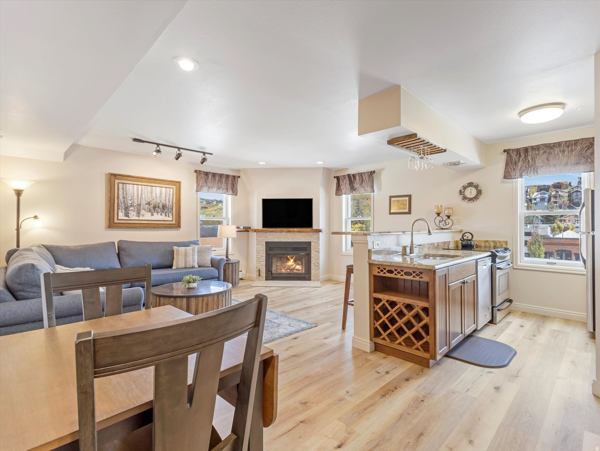 Nestled in the iconic Blue Church Lodge in the heart of Old Town Park City, this beautifully updated 2 bedroom, 2 bathroom single-story condo perfectly blends classic charm with modern luxury. Enjoy breathtaking views of Old Town and Aerie, with abundant morning sunshine to start your day. Both bedrooms feature freshly remodeled ensuite bathrooms, adding a modern touch to this historic gem. Town Lift is just a 7-minute walk away for a day on the slopes, then cozy up by the recently updated stone fireplace or take advantage of the building's amenities, including outdoor hot tubs and your own private ski locker. With dedicated covered parking and just a short walk to Park City's renowned dining, shopping, and entertainment this turnkey condo offers both convenience and charm. Sold fully furnished, it's ready for you and your guests to start enjoying the best of Old Town living! HOA dues include all utilities except internet and cable. There is an additional Reserve Contribution of $522/month on top of the base HOA dues for operating expenses. This contribution has been responsible for recent repairs and improvements at the Blue Church Lodge including new trex decking, roof/gutter repairs and heat tape (2023/24), new improved year-round hot tub deck (2025), new flooring and other renovations in the historic church building (2025), and new shared washer/dryer machines (2024).