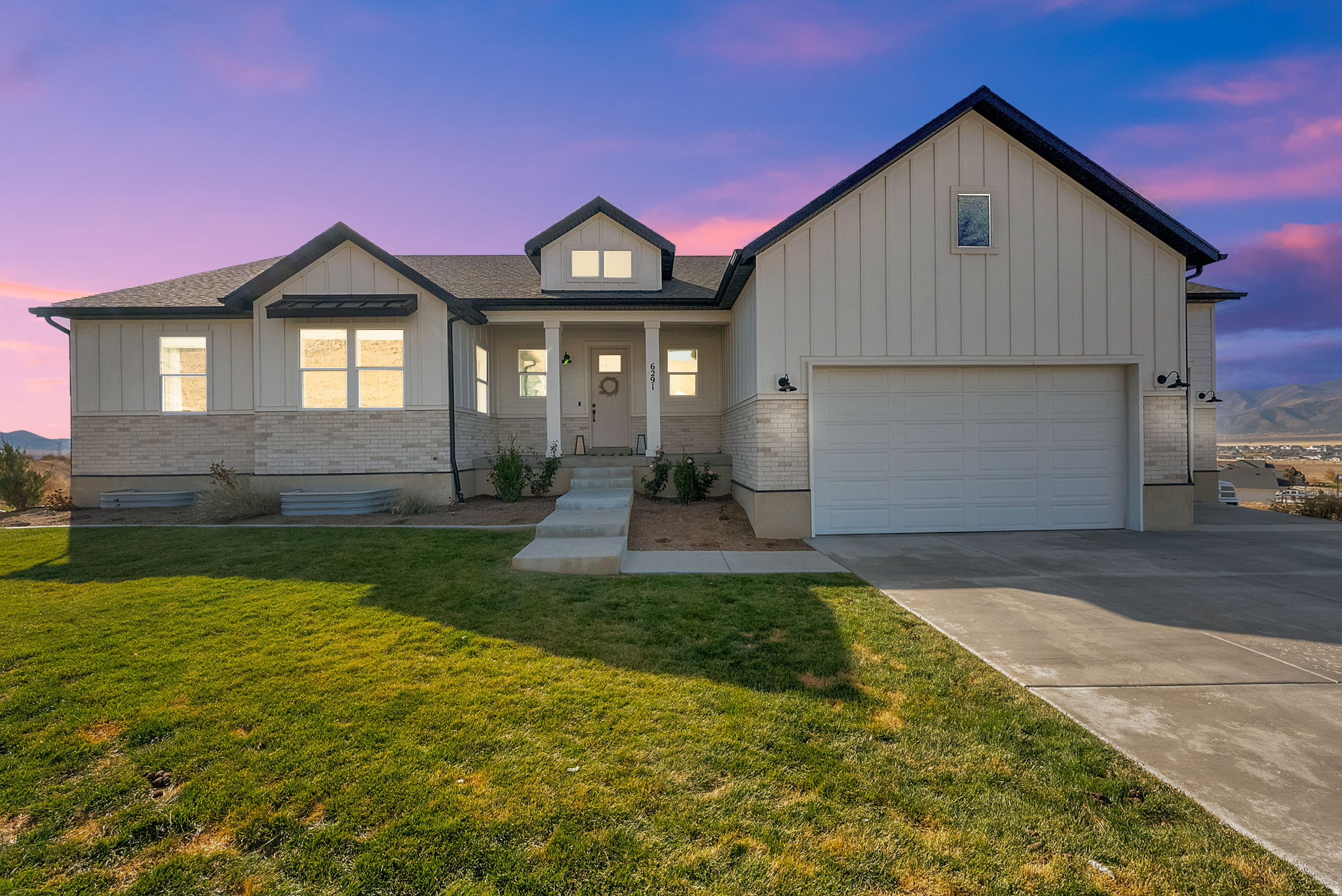 Discover luxury living with this warm and inviting modern farmhouse, perfectly situated on a sprawling 1-acre lot in the coveted Glenmar Ranches neighborhood. Nestled on a quiet cul-de-sac with no through traffic, this stunning single-family home offers unmatched valley and mountain views and the peaceful lifestyle you've been searching for. Featuring 4 bedrooms and 2.5 bathrooms, the home includes a beautifully appointed primary suite with a separate soaking tub and shower, dual sinks, and a massive walk-in closet. The heart of the home is the high-end gourmet kitchen, complete with a walk-through pantry with sliding barn doors, premium finishes, and an ideal layout for cooking and entertaining. Cozy up by the gas fireplace, or step outside onto the expansive covered balcony-perfect for taking in the panoramic scenery. The property is fully suited for horses, goats, or other small livestock, offering both flexibility and freedom. Additional highlights include a massive oversized 3-car garage, modern design elements throughout, and the charm of true farmhouse-style living blended with today's luxury comforts. A rare find in an exceptional location-this is the home that has it all.