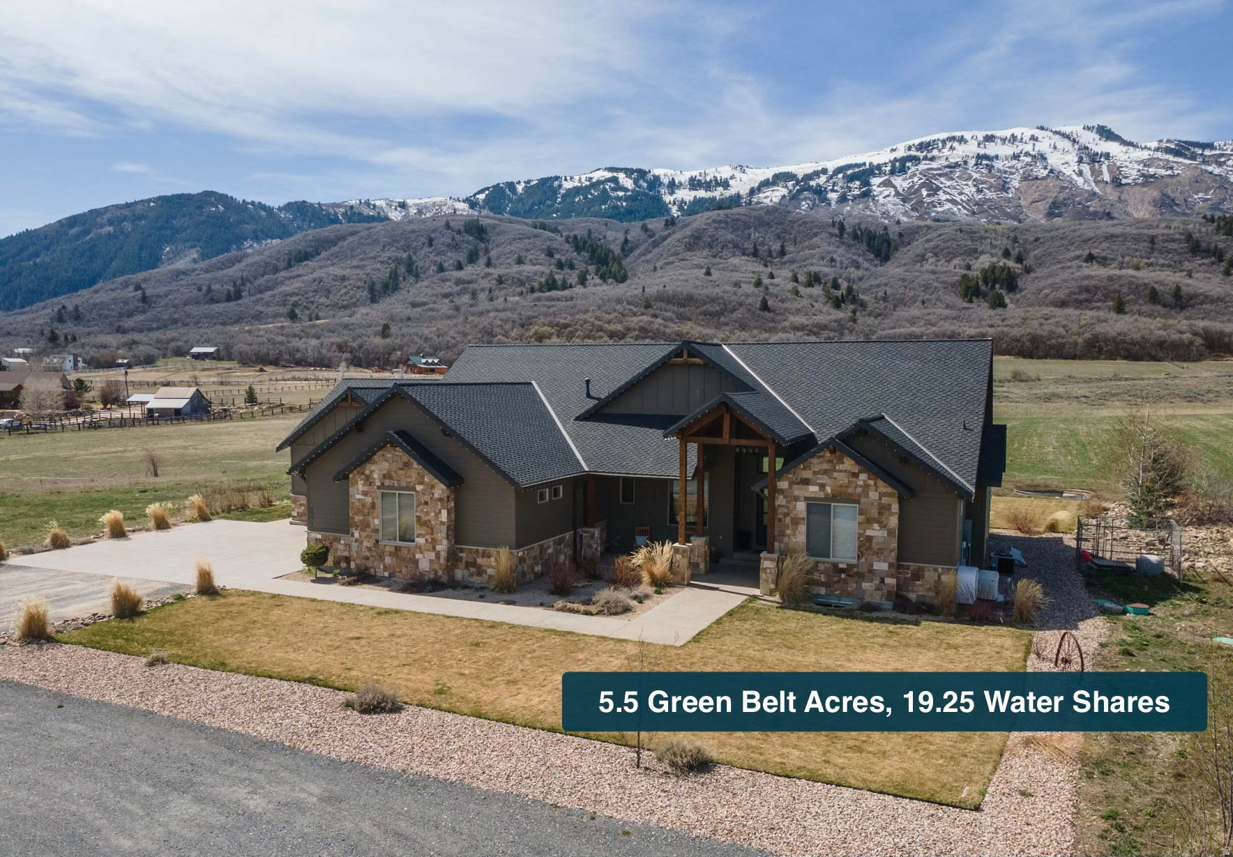 A rare opportunity to own usable acreage in Ogden Valley, this architectural-quality mountain estate offers a refined blend of privacy, wellness, and luxury lifestyle on 5.5 pristine acres in Liberty, Utah. Thoughtfully designed as a turn-key legacy property, the 6,182 sq ft residence features 3 spacious en-suite bedrooms, a dedicated office, and 2 great rooms oriented to capture surrounding mountain views and natural light.  Interior finishes reflect timeless craftsmanship with custom walnut cabinetry, exposed beams, oversized view windows, and a statement real stone fireplace. Escape into the Primary bath with a spa-inspired steam shower. An oversized heated 4-car garage and unfinished lower level with separate garage access provide flexibility for future expansion, guest space, or recreation amenities.  The exterior showcases custom timber accents, Smart siding, Presidential shingle roofing, and commercial-grade custom-fabricated gutters and downspouts-evidence of lasting architectural integrity. Designed for exceptional outdoor living, the property includes water rights, fruit trees, sprinkler system, and covered front and back porches overlooking protected greenbelt with panoramic valley and mountain views.  Experience the quiet luxury of space, nature, and privacy-where mornings begin with farm and alpine sounds and evenings end under expansive mountain skies. Located minutes from 2,600-acre North Fork Park, which was designated a Bronze-tier International Dark Sky Park in 2015. Ideally located minutes from Powder Mountain, Snowbasin, and Pineview Reservoir, this is a distinctive opportunity to secure land, lifestyle, and long-term value in one of Northern Utah's most sought-after mountain communities.