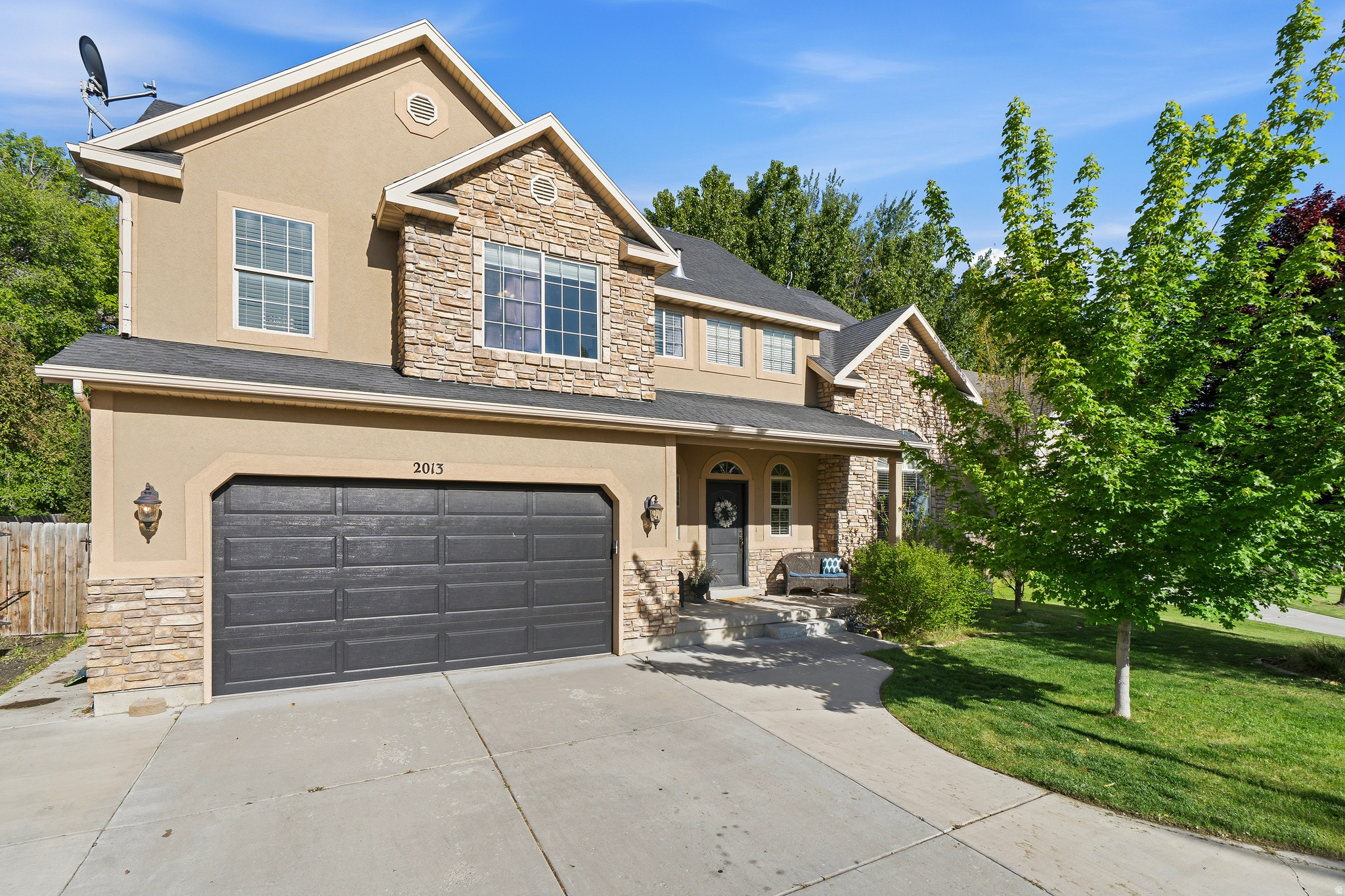 This well-appointed seven-bedroom, four-bathroom house offers approximately 4,082 square feet of living space situated on a lot of approximately 0.2 acres.  The primary bedroom features a spacious layout and ample natural light. The en-suite bathroom includes dual vanities, a walk-in shower, and a separate soaking tub. Five bedrooms upstairs! The fifth bedroom connects to the master bedroom for flexibility of a nursey, office or lock out the door for a fifth bedroom. The basement offers 2 bedrooms, fun gathering space and theater room that all stays! Theater room does have a window that can be uncovered to use as another bedroom. Basement has 10 foot ceilings with large windows.   The home's open floor plan allows for seamless flow between the living, dining, and kitchen areas. The kitchen is equipped with a full suite of appliances and ample counter space for meal preparation. Abundant cabinetry and a pantry offer excellent storage solutions.  Throughout the residence, you'll find hardwood flooring, crown molding, and recessed lighting, creating a warm and inviting atmosphere. Large windows and sliding glass doors allow natural light to flood the interiors, enhancing the overall sense of openness and brightness.  The outdoor living space includes a well-maintained yard, providing opportunities for recreation, relaxation, or potential landscaping enhancements. The property's convenient location offers easy access to a variety of local amenities and services.  Trampoline, washer and dryer along with everything in the theater room can stay!