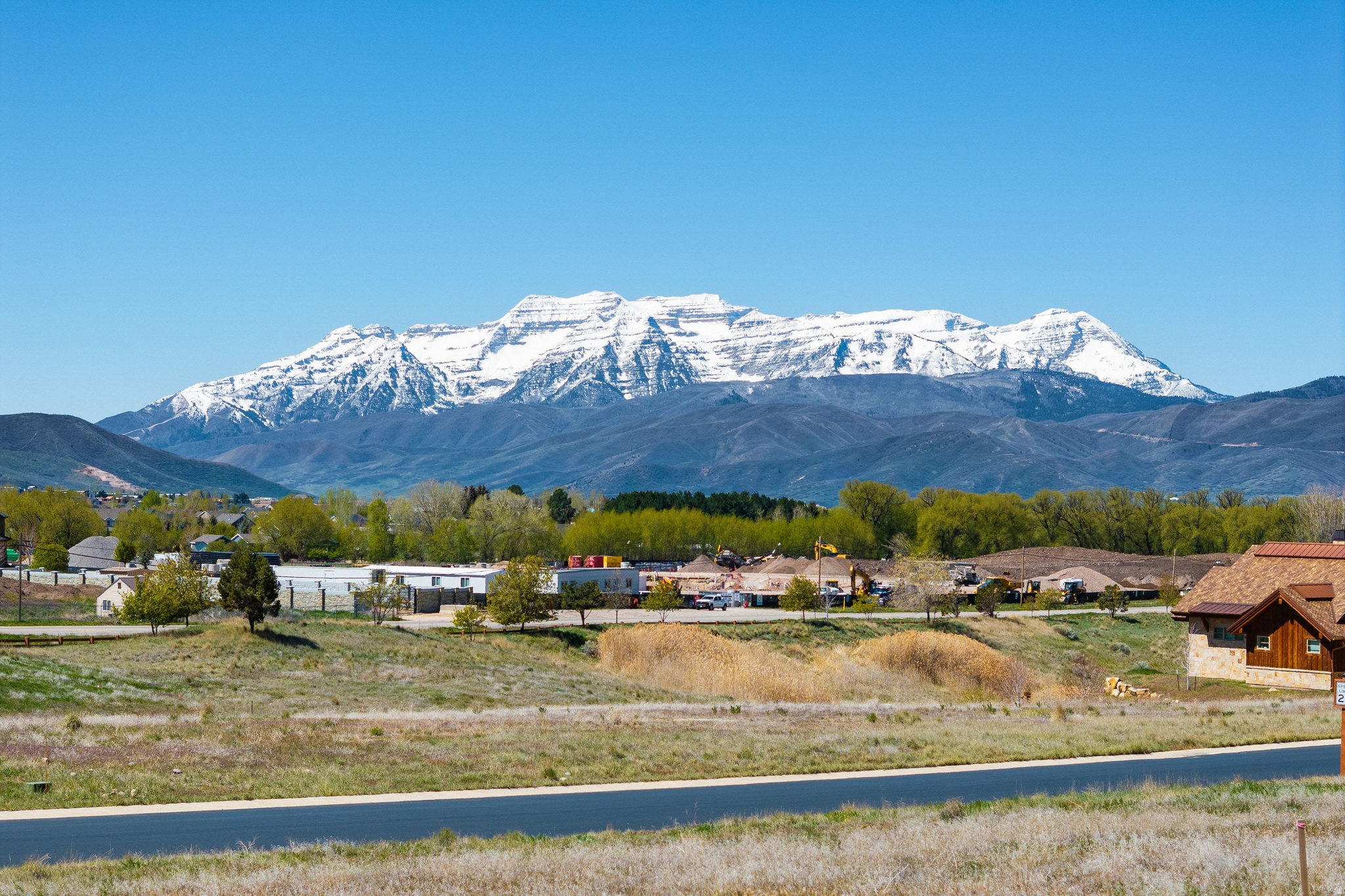 Tucked within Red Ledges, this 0.51-acre homesite offers a rare opportunity to build a custom retreat with panoramic views of the Wasatch Range and Heber Valley. The gently sloped lot provides a versatile building envelope, ideal for capturing natural light and seamless indoor-outdoor living. Surrounded by beautifully crafted homes on a quiet, winding street, the setting offers both privacy and a refined neighborhood feel. Residents enjoy access to Red Ledges' amenities, including golf, tennis, fitness, equestrian facilities, and scenic trails. This lot has a Golf Park Membership available. Just minutes from downtown Heber and approximately 15 minutes to Deer Valley's East Village, this location offers the perfect balance of peaceful mountain living and convenient access to year-round recreation.
