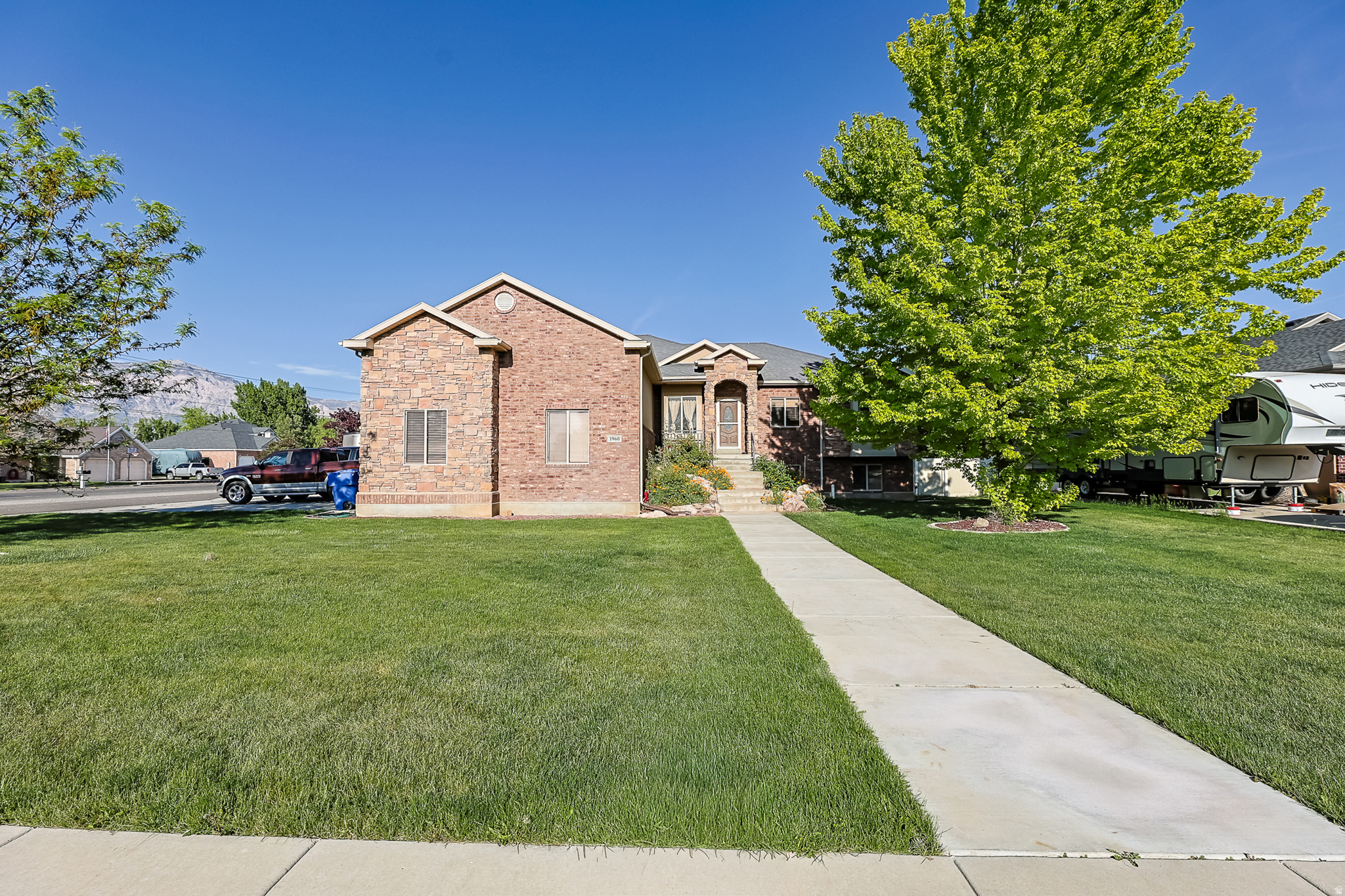 Welcome to this beautiful home situated on a spacious half-acre corner lot with excellent curb appeal. The property offers a standout exterior presence, plenty of open space, and a layout that provides both function and flexibility for everyday living. A major highlight is the oversized parking setup, featuring a 3-car garage plus dedicated RV parking, making it ideal for extra vehicles, trailers, toys, or guests. With its large lot, desirable corner location, and strong first impression, this home offers a rare combination of space, convenience, and curb appeal.