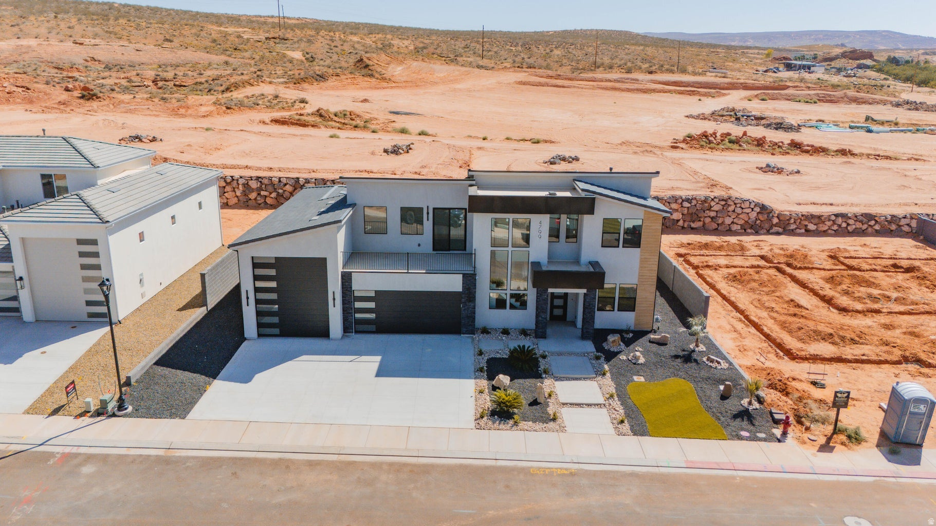 ~Full Custom Home Near Sand Hollow~This stunning Big Rock Homes home in the sought-after Sand Hollow Village area blends modern comfort with the ultimate recreational lifestyle. This home has a massive 52-FOOT DEEP RV GARAGE (12' wide x 14' tall door)! Inside, you'll find an open-concept layout with LUXURY FINISHES, spacious bedrooms, and LARGE BACKYARD WITH ROOM TO ADD A POOL! This property comes equipped with premium SMART HOME features including 3 wired in insecurity cameras and a door bell camera. Just minutes from Sand Hollow Reservoir, Sand Hollow Golf Course, the sand dunes, and Zion National Park, you're surrounded by year-round adventure - boating, biking, hiking, off-roading, and more. Contact listing agent for PRIVATE SHOWINGS.