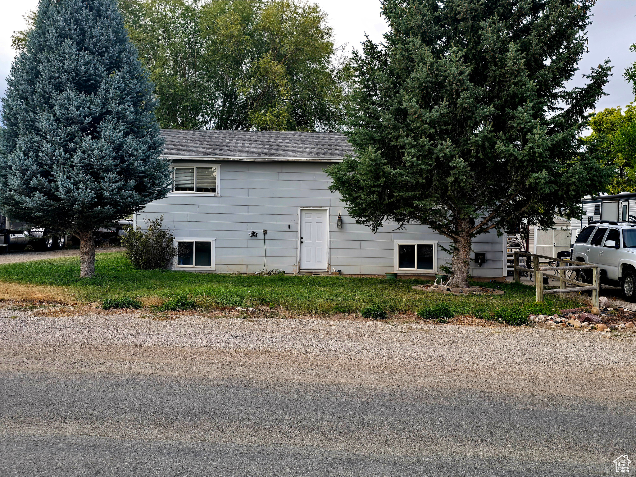 Shop, home and a large country lot. Beautiful views 4 bedroom 2 bath home outside of town. Great area with mature trees and RV hook ups.