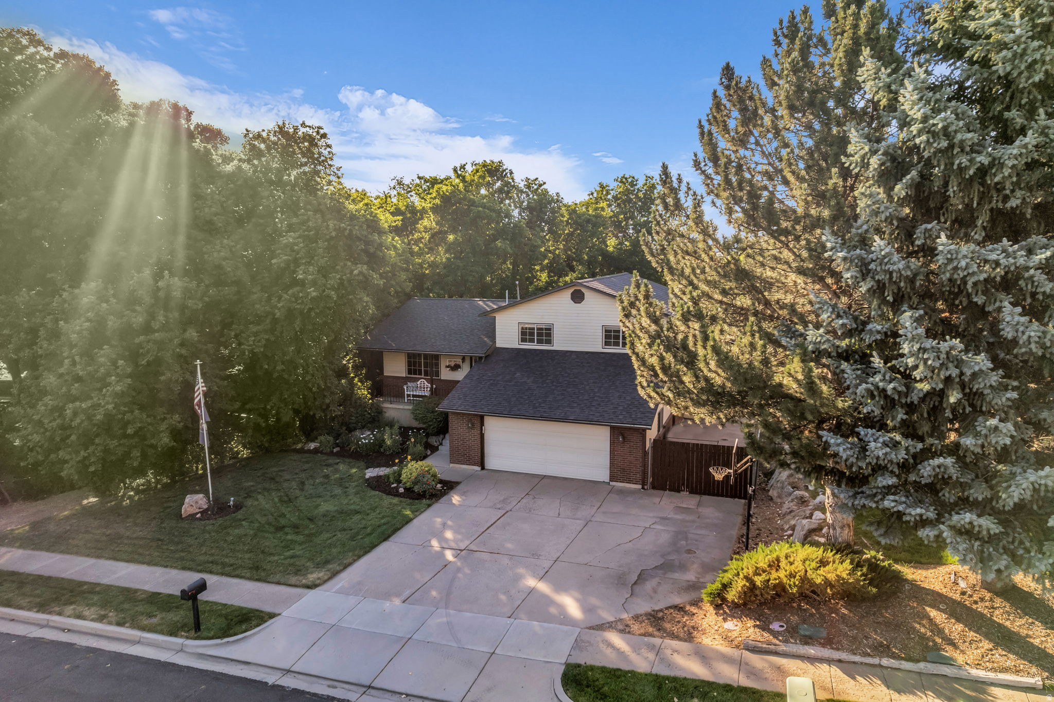 **OPEN HOUSE SATURDAY 6/27 | 11AM-1PM** This is the one you've been waiting for! Welcome to Deer Run Retreat where mature trees wrap the backyard in a private, forest-like feel, THREE decks step down into the woods, and a walkout basement opens to it all. No more having to get away from it all when you have this as your backyard, there's truly nothing on the market like it! Step inside to a fully remodeled, GORGEOUS kitchen with custom cabinetry & pull-outs, hardwood floors & darling built-ins throughout.   Entertaining is effortless here, flowing into a large, fully finished walkout basement with soaring 12-ft ceilings & a wet bar ready for your next party -- or set it up as a separate apartment with its own walkout & private driveway on that side. With 5 bedrooms, 4 baths & a bathroom on every level, there's room for everyone.  Out back just keeps on giving: a secluded, tree-shaded yard that stays cooler all summer long, a beautiful seasonal stream in wet years & a great sledding hill, plus an RV pad & powered shed for all your toys & projects. It feels remote, yet you're minutes from shopping, Hwy 89 & I-15, Hill Air Force Base & the mountains -- in one of South Weber's quietest pockets.  Too many upgrades to list (including an oversized Lennox A/C system, newer water heater & NO HOA) -- come see it before it's gone! Visit **southweberretreat.com for the 3D tour, VIDEO & full feature list** Buyer to verify all information, square footage figures are provided as a courtesy estimate only and were obtained from an appraisal.