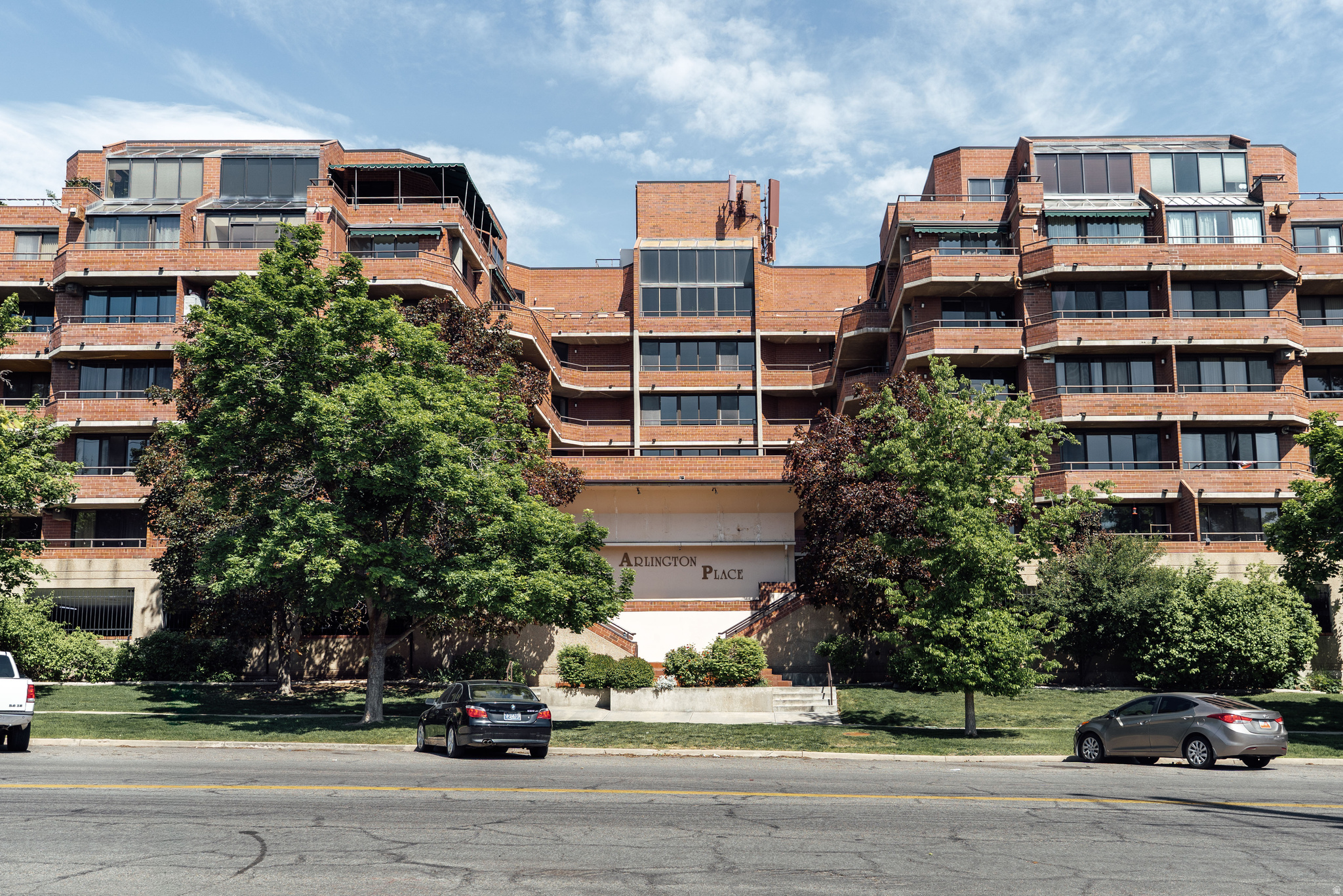 Sunset views, brutalist architecture, and thoughtful updates, this condo truly has it all. Perched on the 7th floor of this architecturally jaw-dropping building sits a one-of-a-kind unit that instantly captures your heart. Located in a charming, walkable neighborhood, the home offers both warmth and sophistication in equal measure. Over the years, the space has been updated with intention. Walls were thoughtfully removed to open up the living room and kitchen, allowing light from the floor-to-ceiling windows and sliding glass doors to bathe the entire space. The result is an airy, inviting layout that feels expansive and perfect for hosting. Just off the living room, a beautifully integrated custom closet blends seamlessly into the design while offering ample storage. The open kitchen, complete with warm marble countertops, brings texture and life to the heart of the home. The primary suite is truly drenched in natural light thanks to floor-to-ceiling atrium windows that open directly onto the patio, offering stunning views through every season. The suite also includes a walk-in closet and luxurious bathroom. The second bedroom is equally special, featuring its own private patio retreat. Lovingly maintained and deeply cared for over the years, this condo is as functional as it is beautiful.