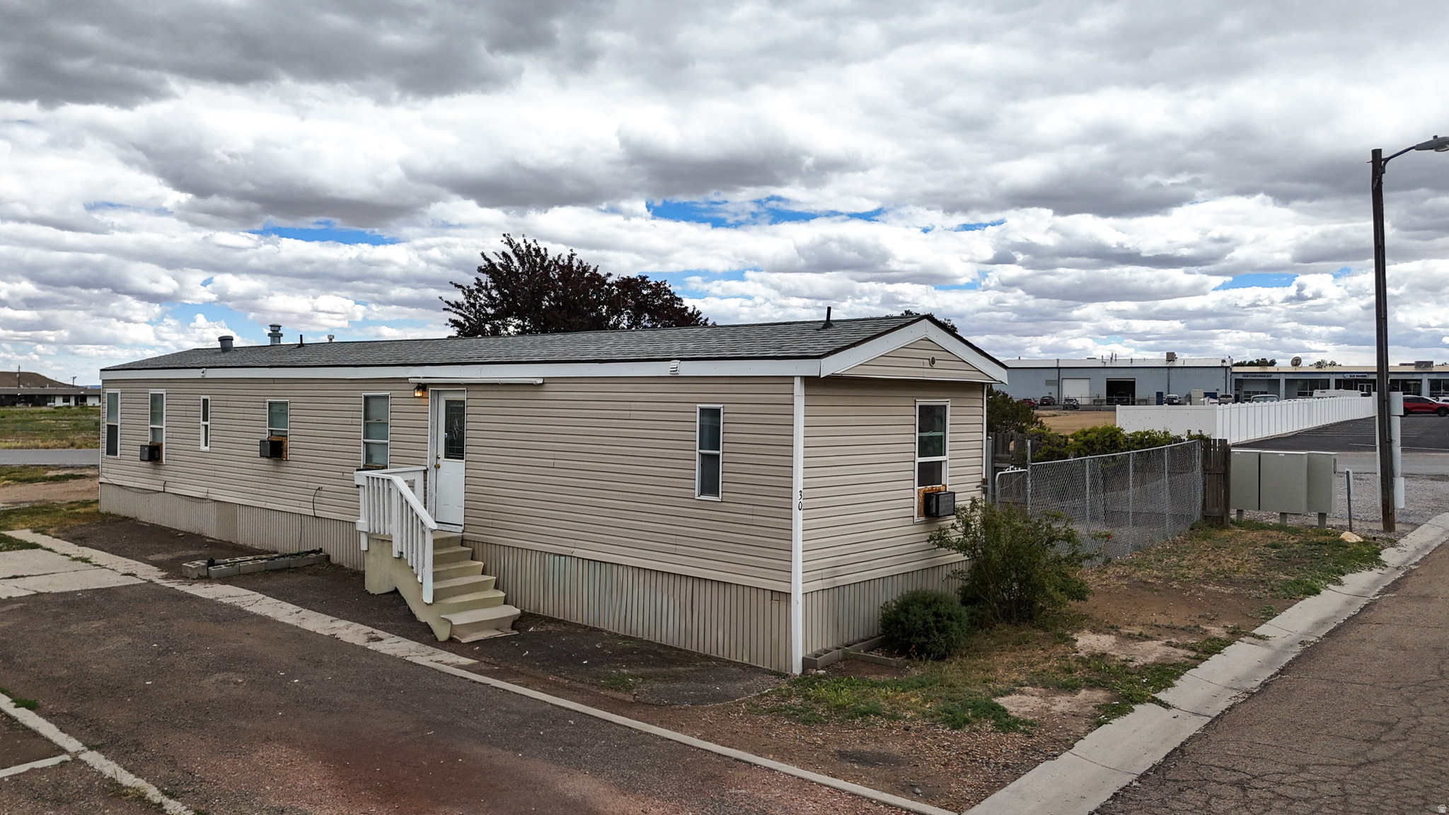 Fresh updates and stylish touches make this 3-bedroom, 2-bath manufactured home in the Lila Canyon Mobile Home Park a standout! Located at 1101 S. Carbon Avenue #30, this home features updated flooring, paint, light fixtures, a gas range, a new water heater, and individual air-conditioning units in each room for personalized comfort. The spacious layout includes a fenced side yard perfect for pets, outdoor entertaining, or relaxing evenings. A new water heater adds even more value and peace of mind. Affordable, move-in ready, and full of charm!  Square footage figures are provided as a courtesy estimate only.  Buyer is advised to obtain an independent measurement.