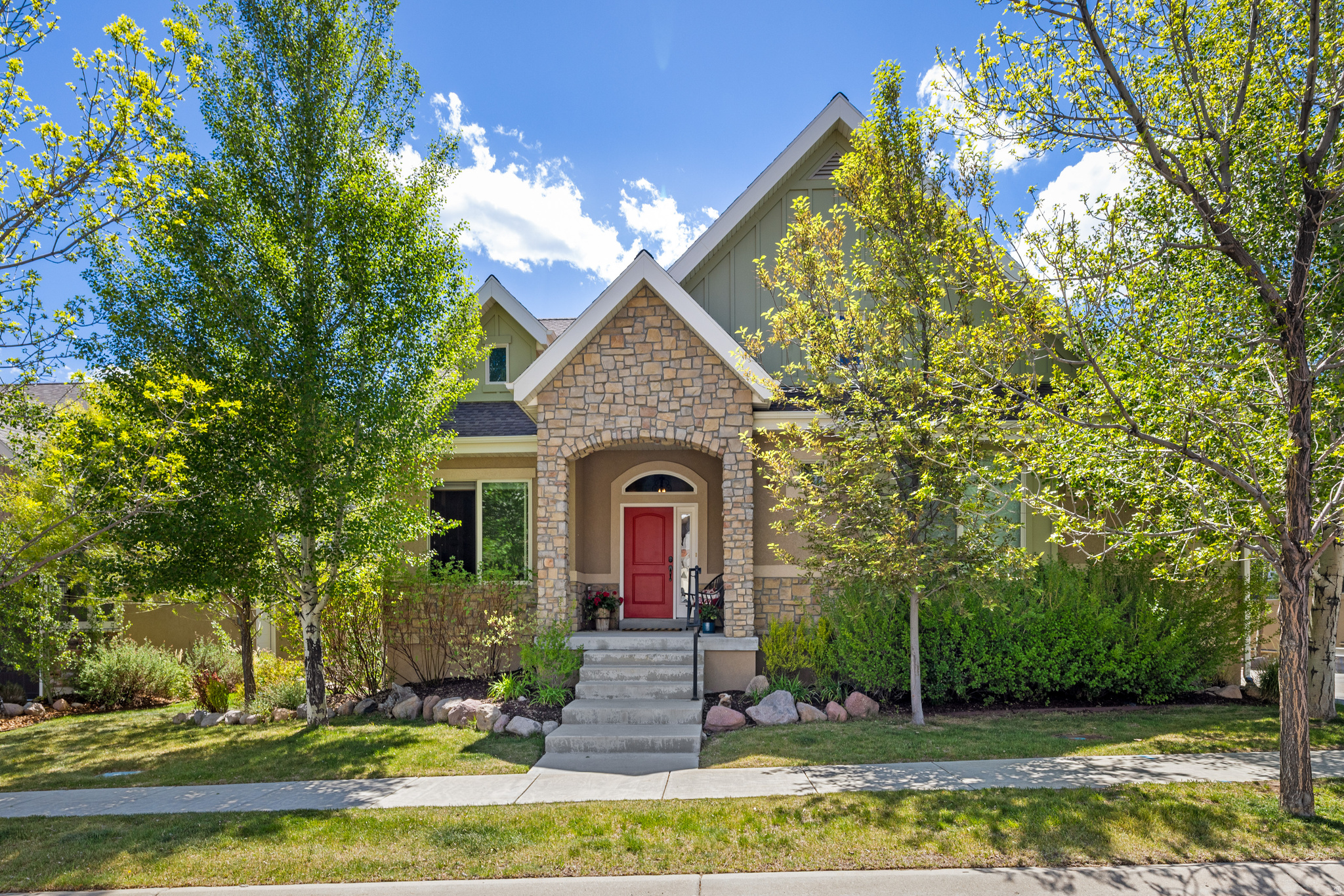 Watch the sun sink beneath the peaks of Mount Timpanogos from this charming 3-bedroom cottage, conveniently located just five minutes from Deer Valley East Village in the desirable River View community. This residence is centered on alpine scenery, with panoramic mountain views from the great room, kitchen, deck, and primary suite. The main level features a great room with hardwood flooring open to the kitchen, dining area, and deck, along with a primary suite with walk-in closet, an expansive home office, and a lovely powder room. The lower level offers a private retreat with a spacious den opening to a patio surrounded by mature trees, two unique bedrooms, one full bath, and an expansive laundry room previously used as a fourth bedroom. A short, flat driveway leads to a bright two-car garage with additional storage.This home is meticulously maintained with newer HVAC system and hot water heater. Residents of River View appreciate that the HOA maintains landscaping and lawns, plows the roads, and even clears snow from their driveways. The community includes a pool and spa, fitness room, and walking trails. Ideally located just minutes from blue-ribbon fly fishing on the Provo River, world-class skiing at Deer Valley, boating on Jordanelle Reservoir, hiking and biking on Coyote Loop, golf in Midway, and dining and shopping in Midway and Heber.