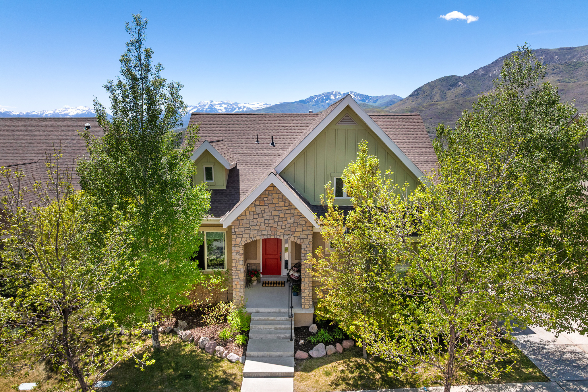 Just five minutes from Deer Valley East Village, this impeccably maintained home offers a rare opportunity for year-round mountain living at exceptional value. Nestled in Heber's sought-after River View community at the entrance to charming Midway, it provides effortless access to world-class skiing, Jordanelle Reservoir, championship golf, blue-ribbon fly fishing, and miles of hiking and biking trails, all complemented by serene mountain views and a low-maintenance lifestyle. Thoughtfully designed for both full-time living and easy second-home ownership, the residence features a main-level primary suite with views, open living areas and a private main level office. A lovely deck extends the living space outdoors, framing sweeping sunsets over Mt. Timpanogos, while lower level guest rooms and flexible living areas offer ample space for family and visitors. River View enhances the experience with resort-style amenities including a pool, clubhouse, fitness center, playground, and comprehensive lawn, landscaping, and snow removal services, allowing more time to enjoy the surrounding landscape and recreation. Ideal as a primary residence, mountain retreat, or lock-and-leave escape, this home combines convenience, natural beauty, and enduring value just moments from one of North America's fastest-growing four-season destinations. Experience elevated mountain living without the premium.
