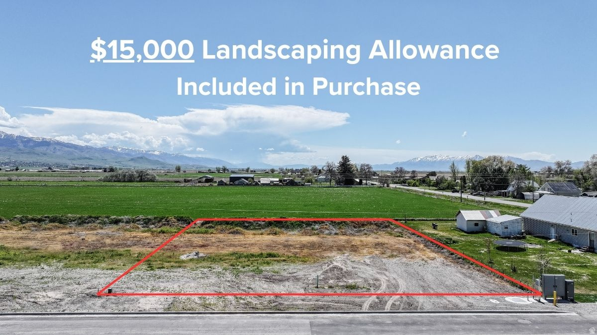 Build your dream home in a setting that offers the perfect blend of rural charm and connected community living. This exceptional homesite features sweeping views of Cache Valley and surrounding farmland, creating a peaceful backdrop with stunning year-round scenery. Located on the same street as elementary school and within a walkable small-town community, this property offers both convenience and lifestyle appeal. Curb and gutter are already in place, adding value and ease for future construction, and city sidewalk will be finished with construction of home. Plus, enjoy a generous $15,000 landscaping allowance to help bring your vision to life. A rare opportunity to create a custom home in a location that combines open space, community connection, and everyday convenience.