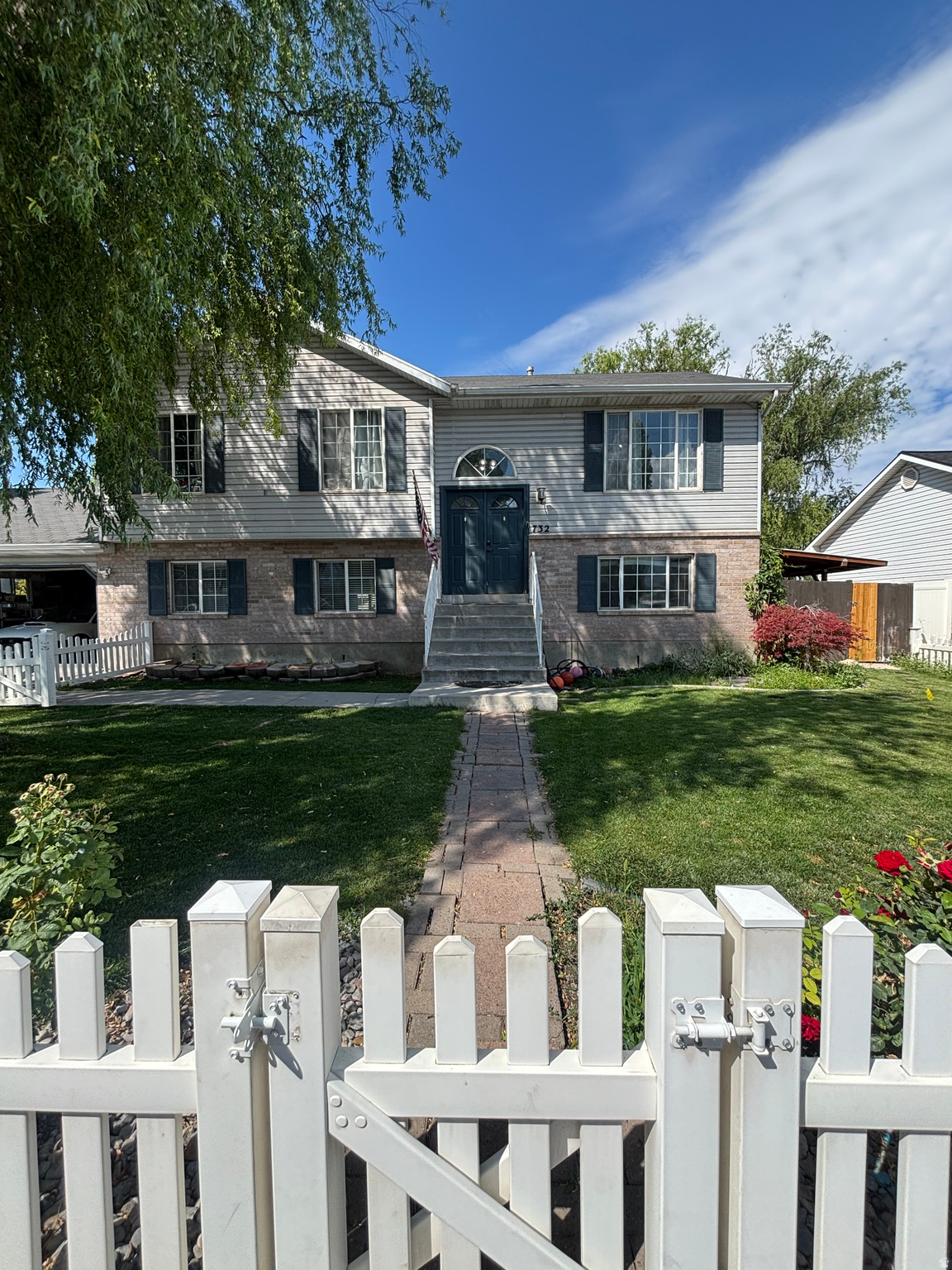 Don't miss this beautifully maintained 5-bedroom, 3-bath home located in an established neighborhood on the west side of the freeway in Orem. Enjoy a convenient location just minutes from shopping, parks, schools, UVU  and easy freeway access. this inviting home features mature trees, a welcoming double-door entry, and a spacious, fully landscaped backyard perfect for relaxing or entertaining. The fully finished walkout basement opens through sliding glass doors to a covered patio and a lush grassy yard, creating the ideal indoor-outdoor living space. Additional highlights include a 2-car garage, RV parking, central air, a fully fenced yard, automatic sprinklers, and beautiful mountain views. This move-in ready home offers space, comfort, and an unbeatable location.