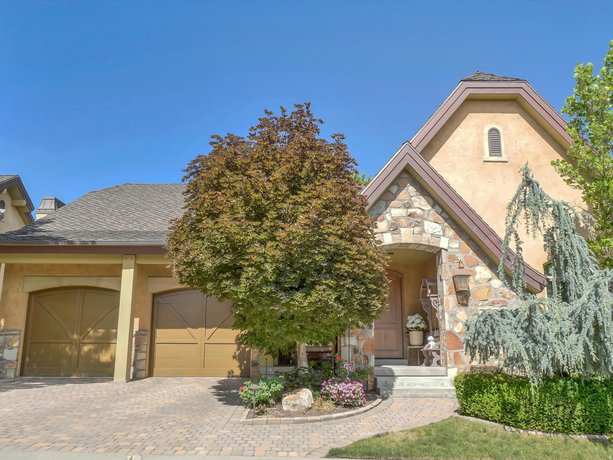 Situated in the exclusive Monte Luca gated community, this luxurious residence is located in a very private part of the community with private back yard. Boasting high end finishes throughout including huge, vaulted timber beam wood ceilings, full rock fireplaces, plank hardwood flooring, 8-foot-stained knotty alder doors, high end appliances including Sub Zero, Miele, Wolfe. Pella windows trimmed in stain grade knotty alder, stained plantation shutters, all casing and baseboards with glazed stain making this one of the finest homes in Cottonwood Heights. Located between Big and Little Cottonwood Canyons, just minutes to Ski Resorts, hiking, biking, mountain adventures and Willow Creek Country adjacent to community. Full home theater located under garage, granite counters throughout, full basement kitchen, craft/wrapping room. Monte Luca residents enjoy a luxury clubhouse, many streams and lakes security gate and incredible views. Square footage figures are provided as a courtesy estimate only and were obtained from county records. Buyer is advised to obtain an independent measurement.