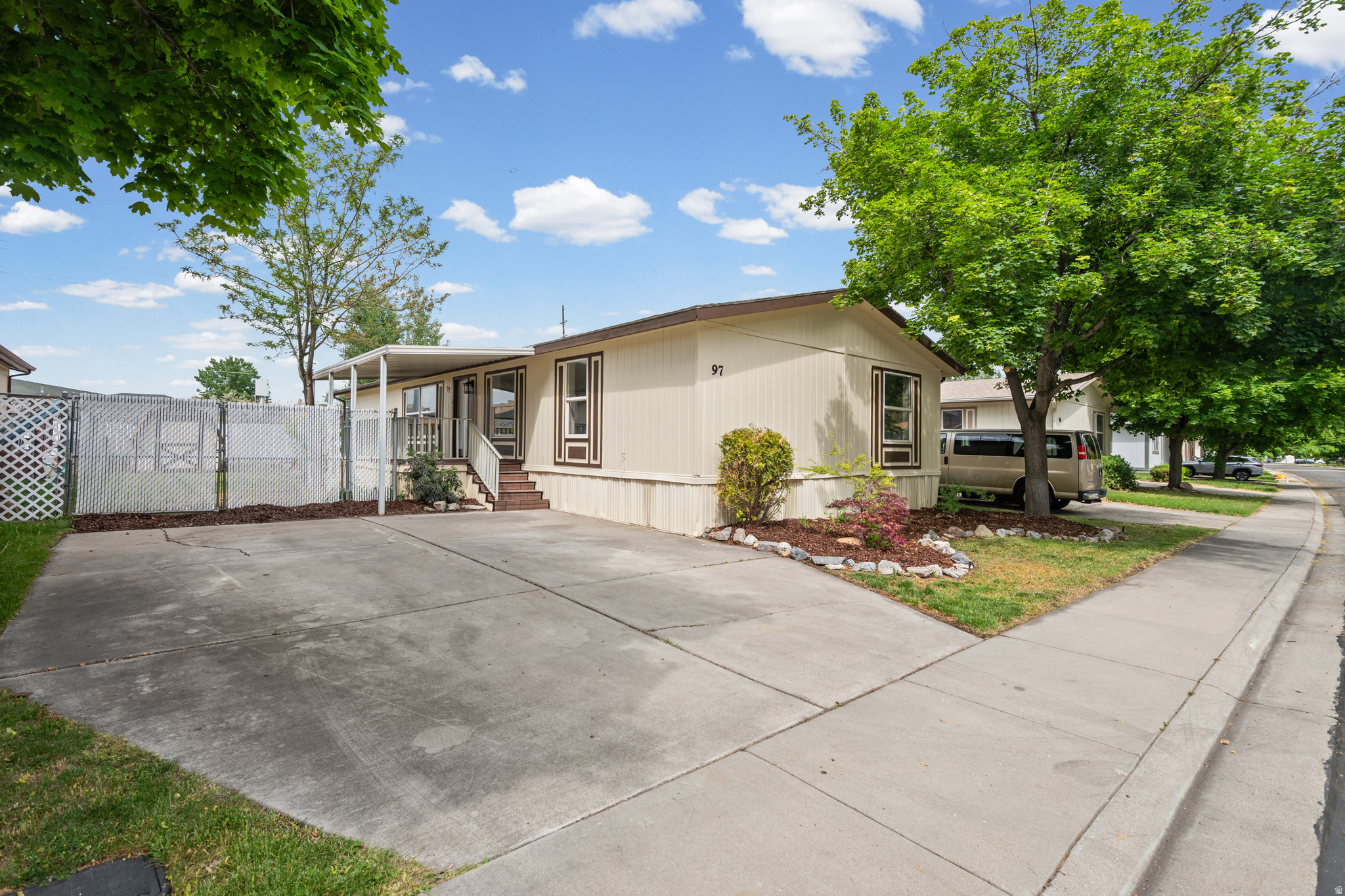 Beautifully updated  mobile home located in a quiet, clean, and well-kept community. This spacious 4 bedroom, 2 bathroom home offers approximately 1,836 sq ft with a functional open layout, large living area, dining space, and dedicated laundry room. Several bedrooms feature walk-in closets for added storage and convenience. Recent upgrades include new flooring, fresh paint, refinished cabinets, updated countertops, modern fixtures, new hardware throughout, newer windows, newer roof, and new patio decking. Fully fenced yard with room to relax, entertain, or play. Move-in ready with possible seller financing available!