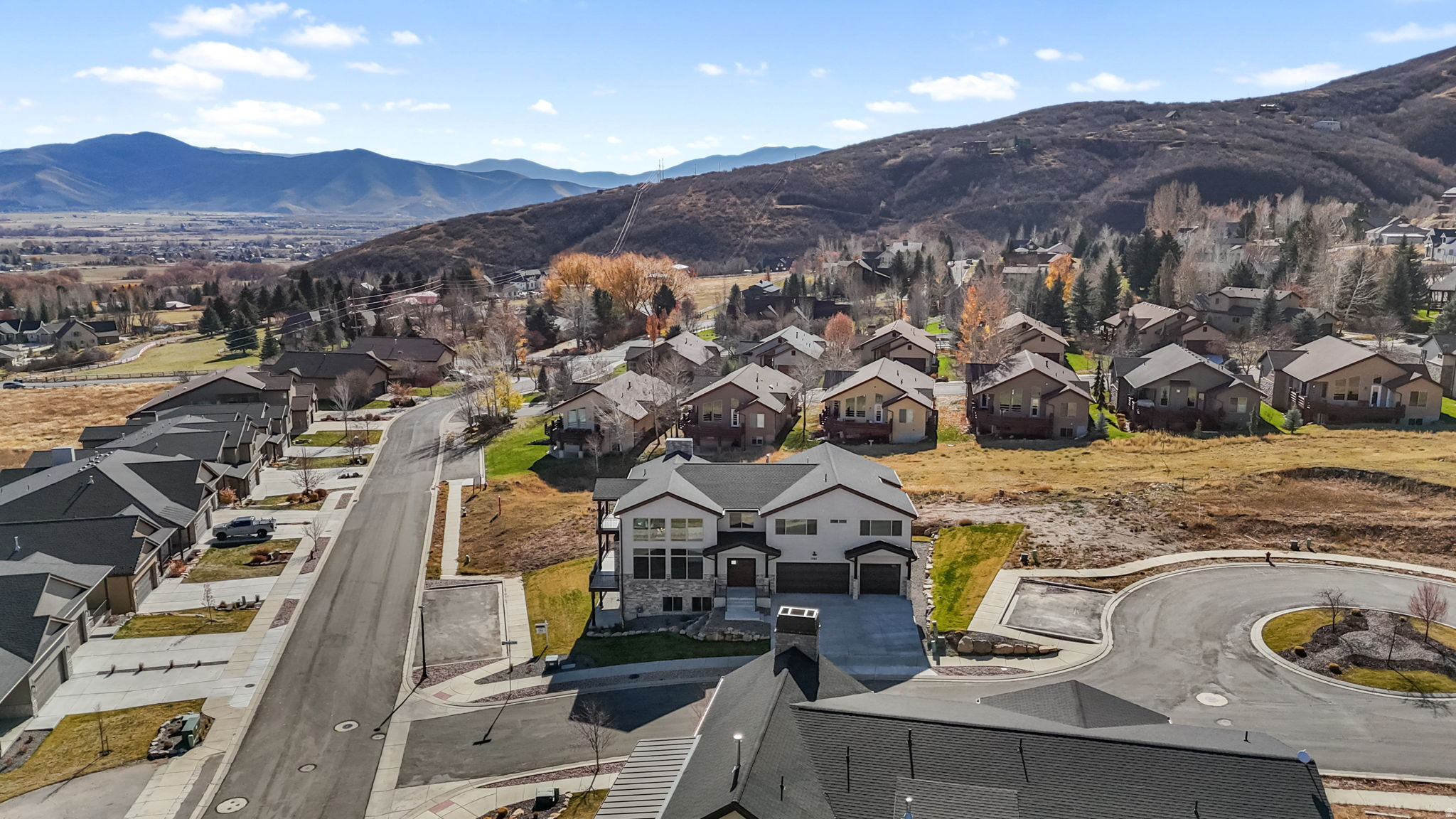 SELLER FINANCING AVAILABLE! This newly built custom single family home in the peaceful Sunburst Ranch neighborhood, with unobstructed mountain and valley views! Your new home in Sunburst Ranch is on the western bench of Midway. It is the perfect combination between luxury living and the rural lifestyle many have only dreamed of. There are mountain views from every level of the home with two large covered balconies and a lower level covered patio. Features also include vaulted living room ceilings, an open floor plan, and large windows that bring in natural light and mountain views. The luxury kitchen includes soft close cabinets and drawers, gas stove, and quartz countertops. Downstairs features a large theater room, walkouts from two of the 3 bedrooms, a large family room, and a wet bar. Hymark Homes' construction and finishes are premium in the building business. You can be assured a premium built product with a 1 -year builders home warranty to call your home. Sunburst Ranch provides a beautiful balance between a secluded and quiet home yet close to Midway's famous crater, shops, lodges and restaurants as well as all that Park City has to offer just 30 miles away. Square footage figures are provided as a courtesy estimate only and were obtained from the building plans. Buyer is advised to obtain an independent measurement. The landscaping is included in the price of the home and will be installed by the builder according to the HOA standards.