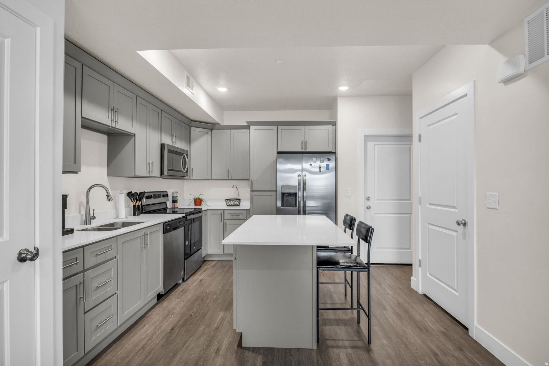 *BACK TO MARKET, SELLER FINANCE DEFAULTED!***VA assumable loan at 5.99%*** This beautifully maintained 1-bedroom with an office/den for an optional 2nd bedroom, 1-bathroom condo offers modern living with stunning mountain views from the fourth floor. The unit features an open floor plan, perfect for comfortable living. The bright living room with  sliding glass doors that lead to a walk-out balcony, ideal for enjoying the scenic views. The kitchen is complete with quartz countertops, shaker-style cabinets, and a convenient pantry for additional storage. Enjoy access to on-site amenities, including a fully equipped gym, and take advantage of the condo's prime location near shopping, schools, Hill Air Force Base, and easy freeway access. Square footage figures are provided as a courtesy estimate only and were obtained from County records. Buyer is advised to obtain an independent measurement.